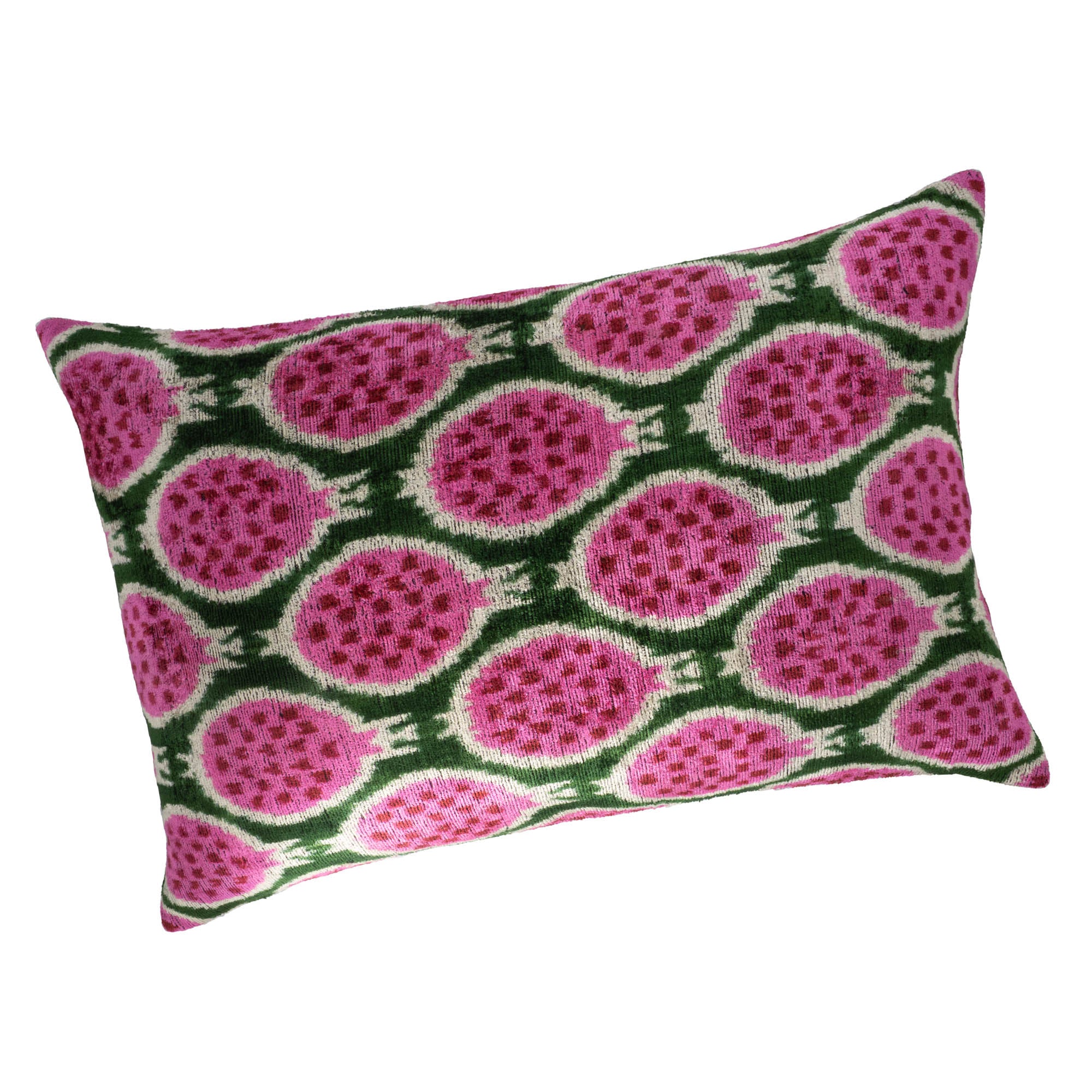 Rectangular silk velvet pillow cover with vibrant pink pomegranate ikat pattern on green background.