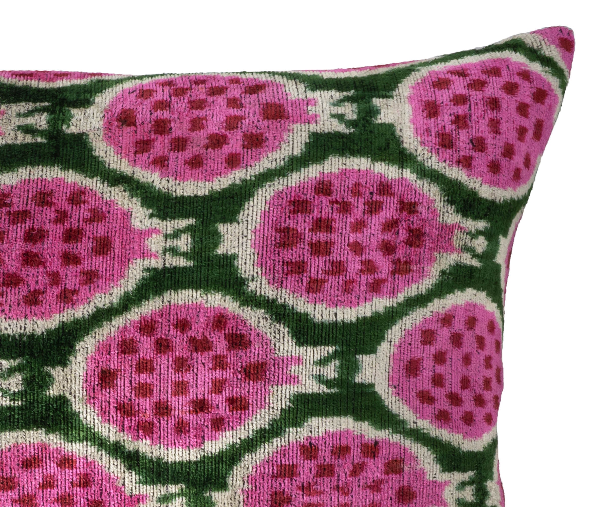 Colorful ikat throw pillow in pure silk velvet featuring handwoven pomegranate design.