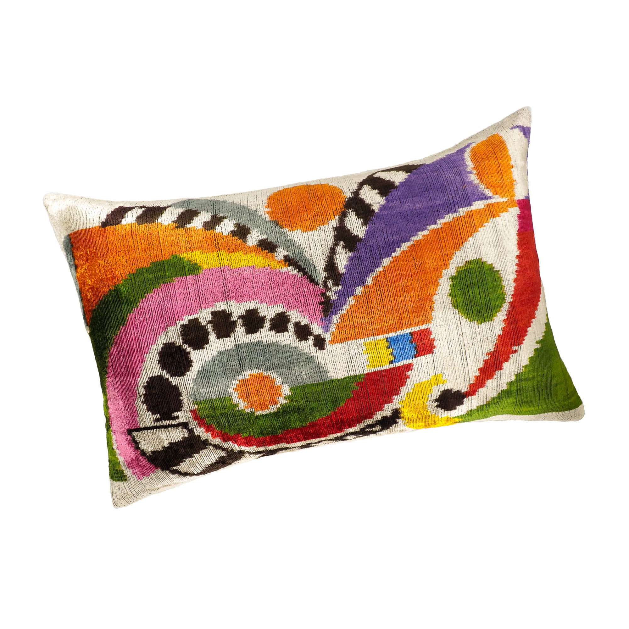 Chouchou Touch Ra pillow with vibrant geometric shapes in orange, purple, pink, green, and black.