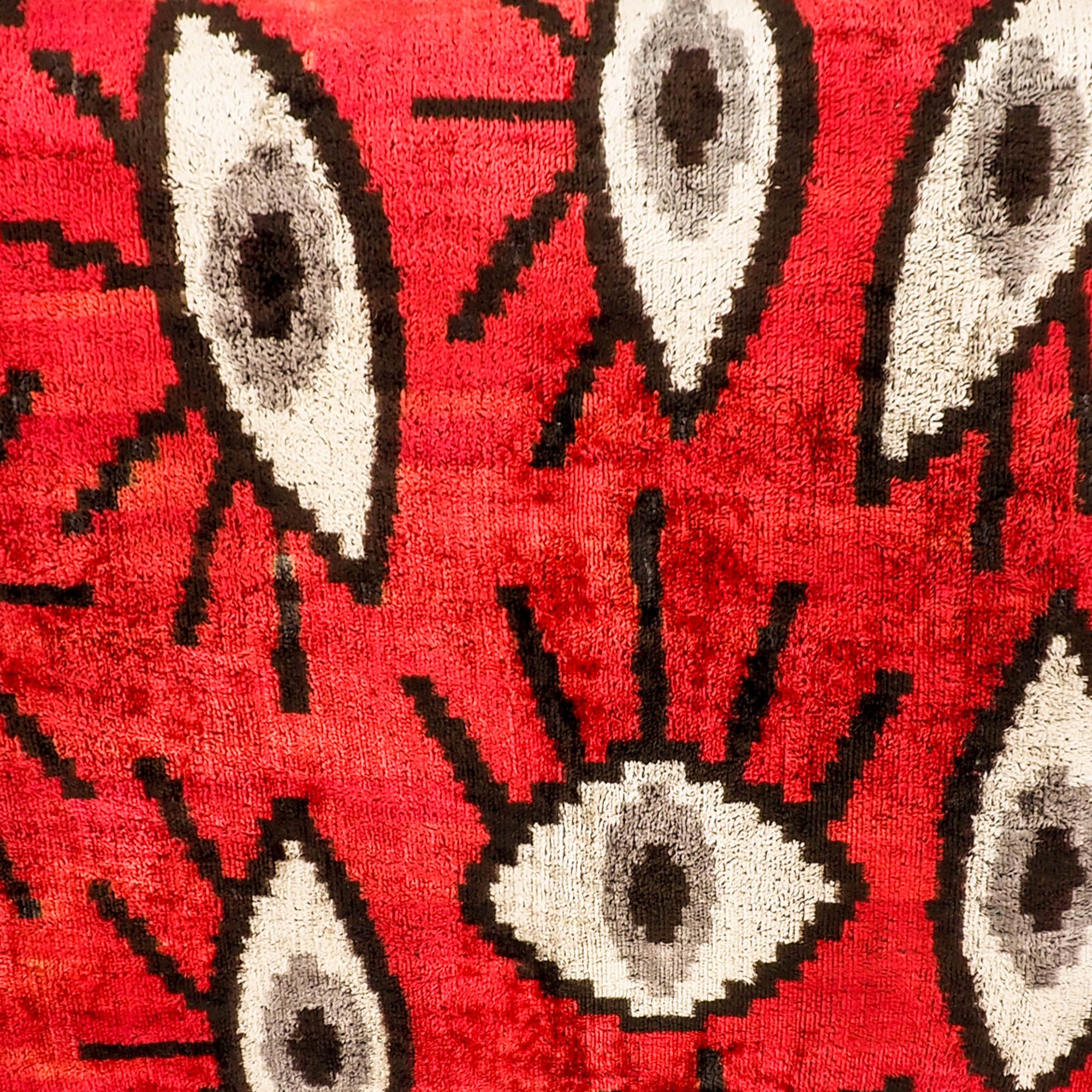 Red Eyes Silk Velvet Ikat Throw Pillow Cover, 16 x 24, with vibrant red hues and traditional Ikat weaving techniques on 100% silk velvet, offering a luxurious touch to your space.
