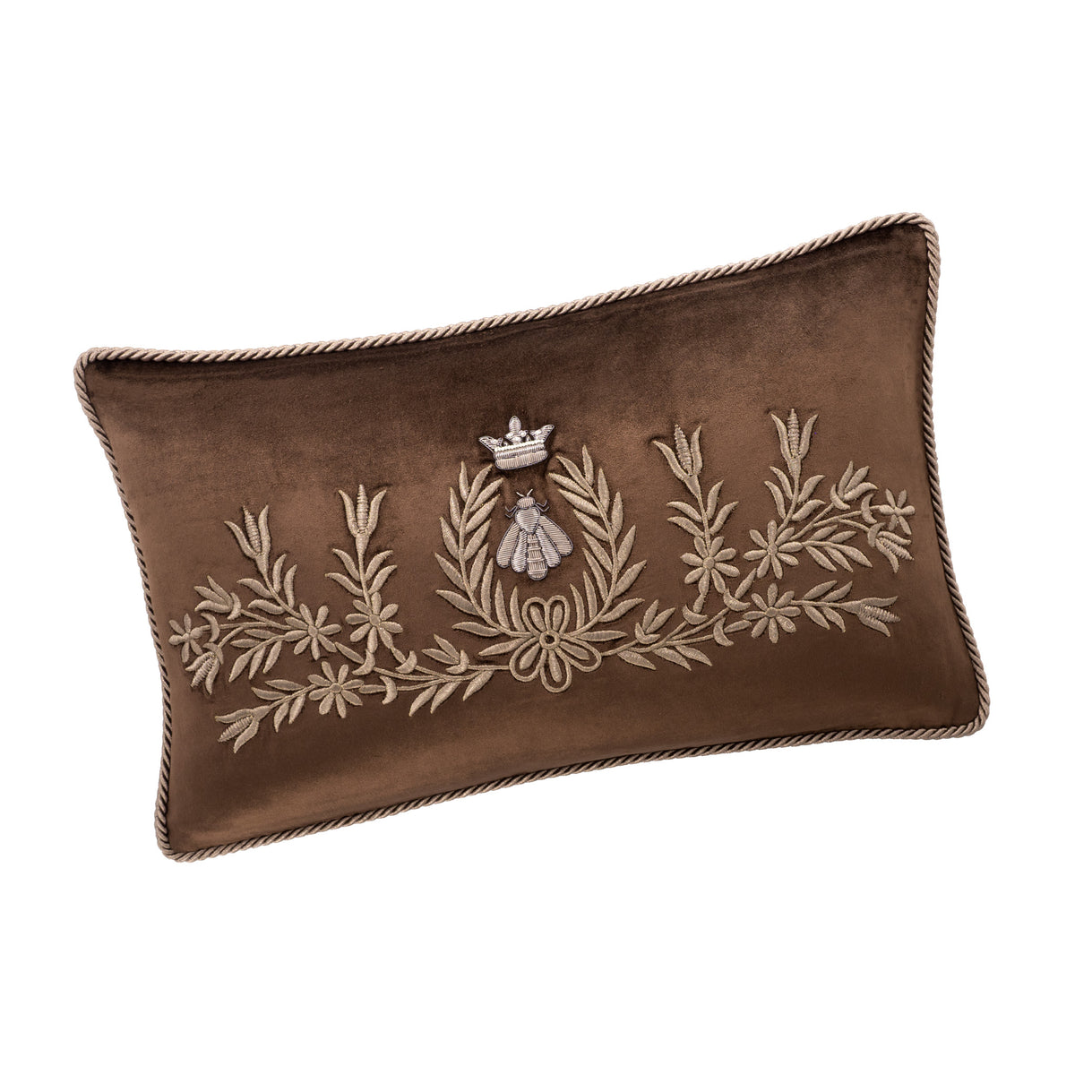 Angled view of the Regina brown silk velvet pillow cover, showing antique-gold crowned bee and floral embroidery with twisted cord trim.