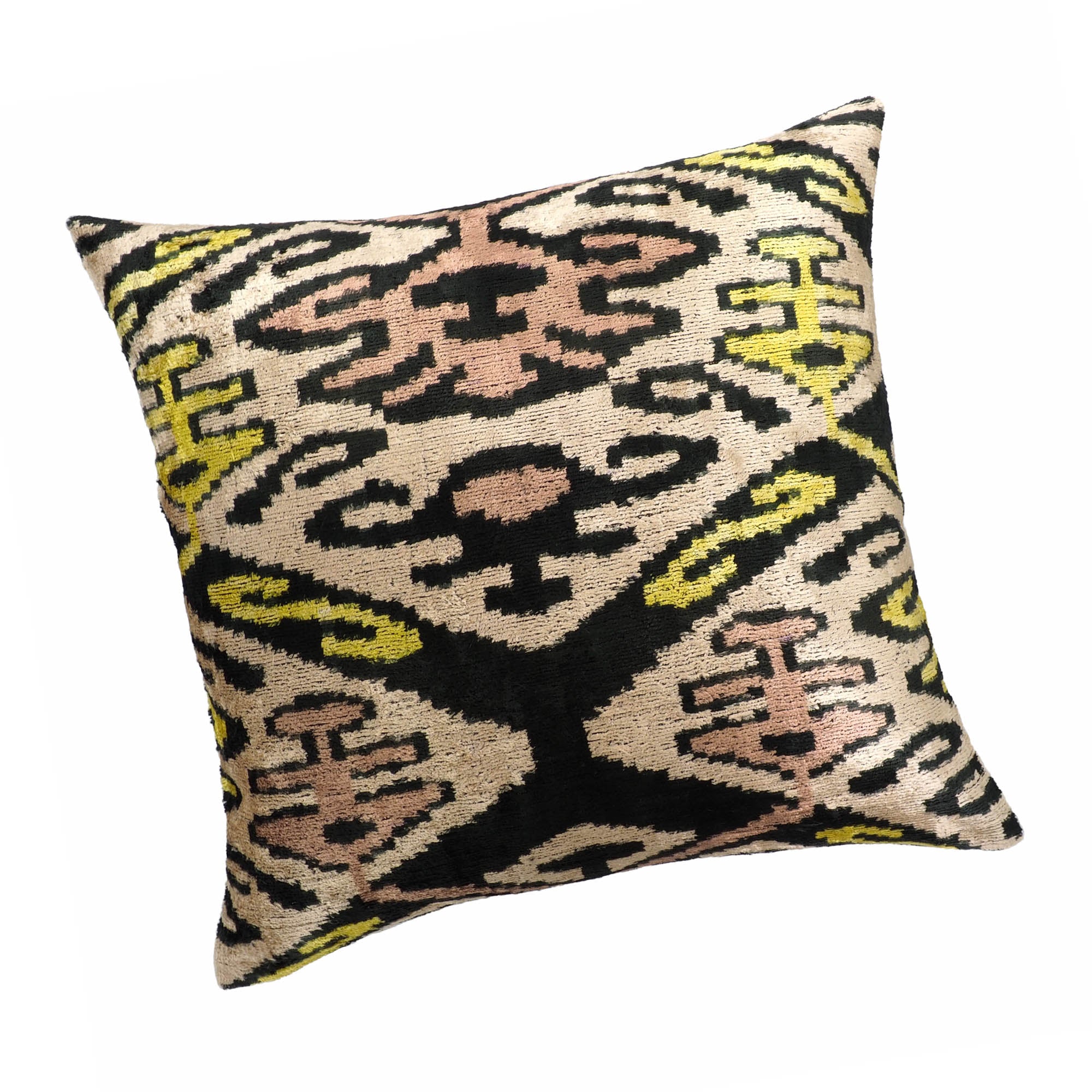 Handwoven ikat pillow with bold tribal pattern in earthy pastels and deep black contrast.