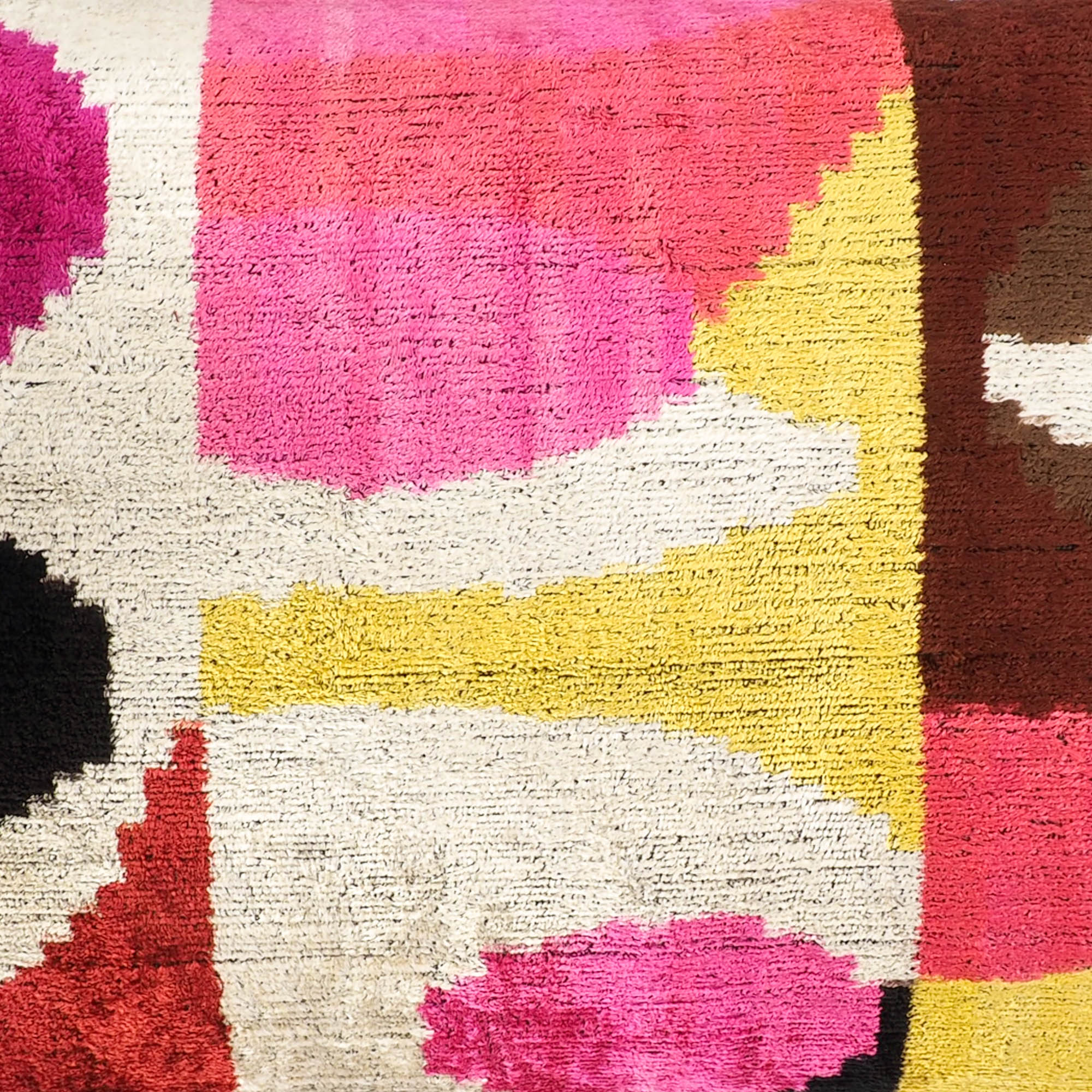 Rio Rio Silk Velvet Ikat Throw Pillow, 16 x 24, handwoven with 100% silk, showcasing a bold and colorful Ikat design for an eye-catching addition to your furniture.
