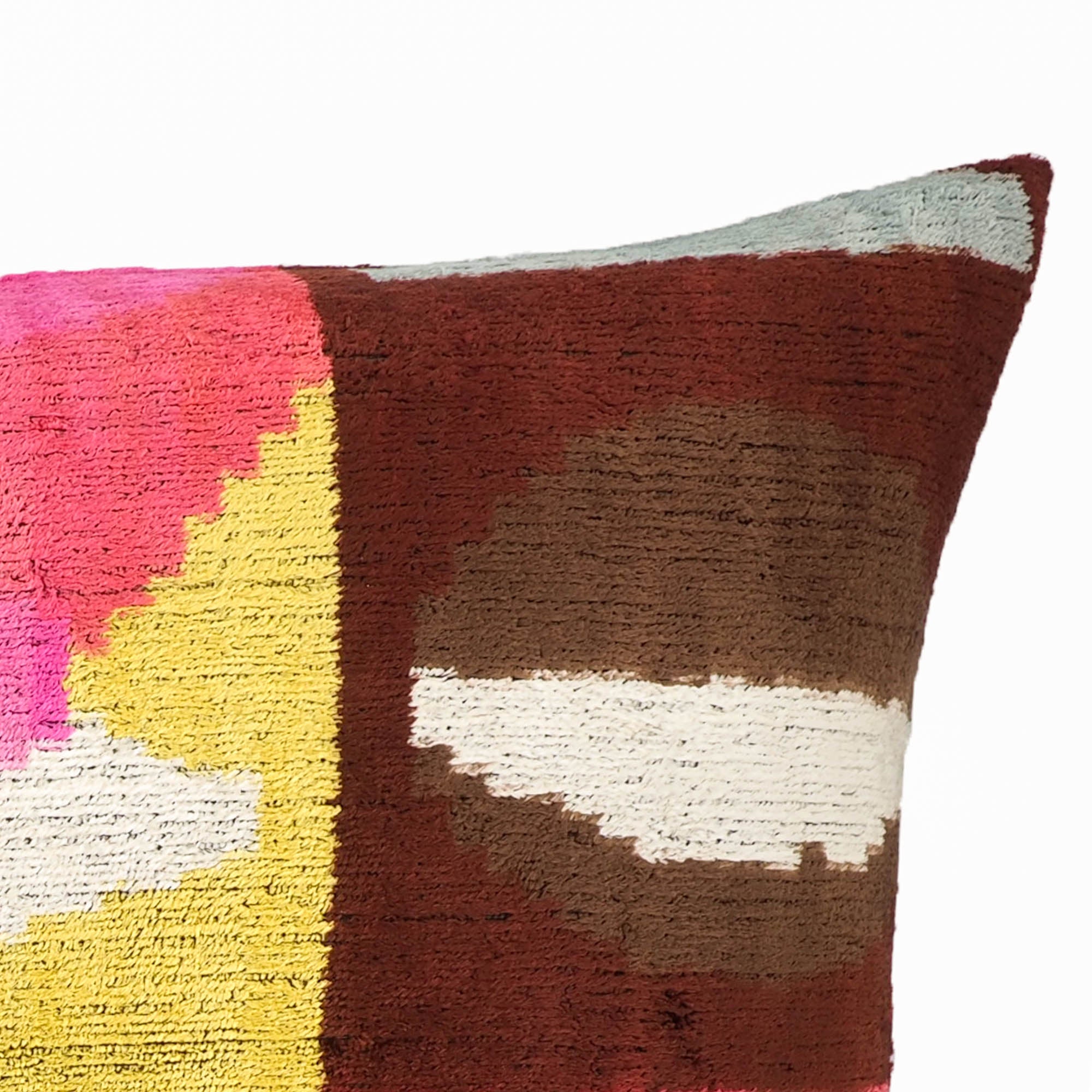 Chouchou Touch Rio Rio Silk Velvet Ikat Pillow, 16 x 24, offering an elegant and colorful Ikat design woven into soft silk velvet fabric for luxurious home styling.