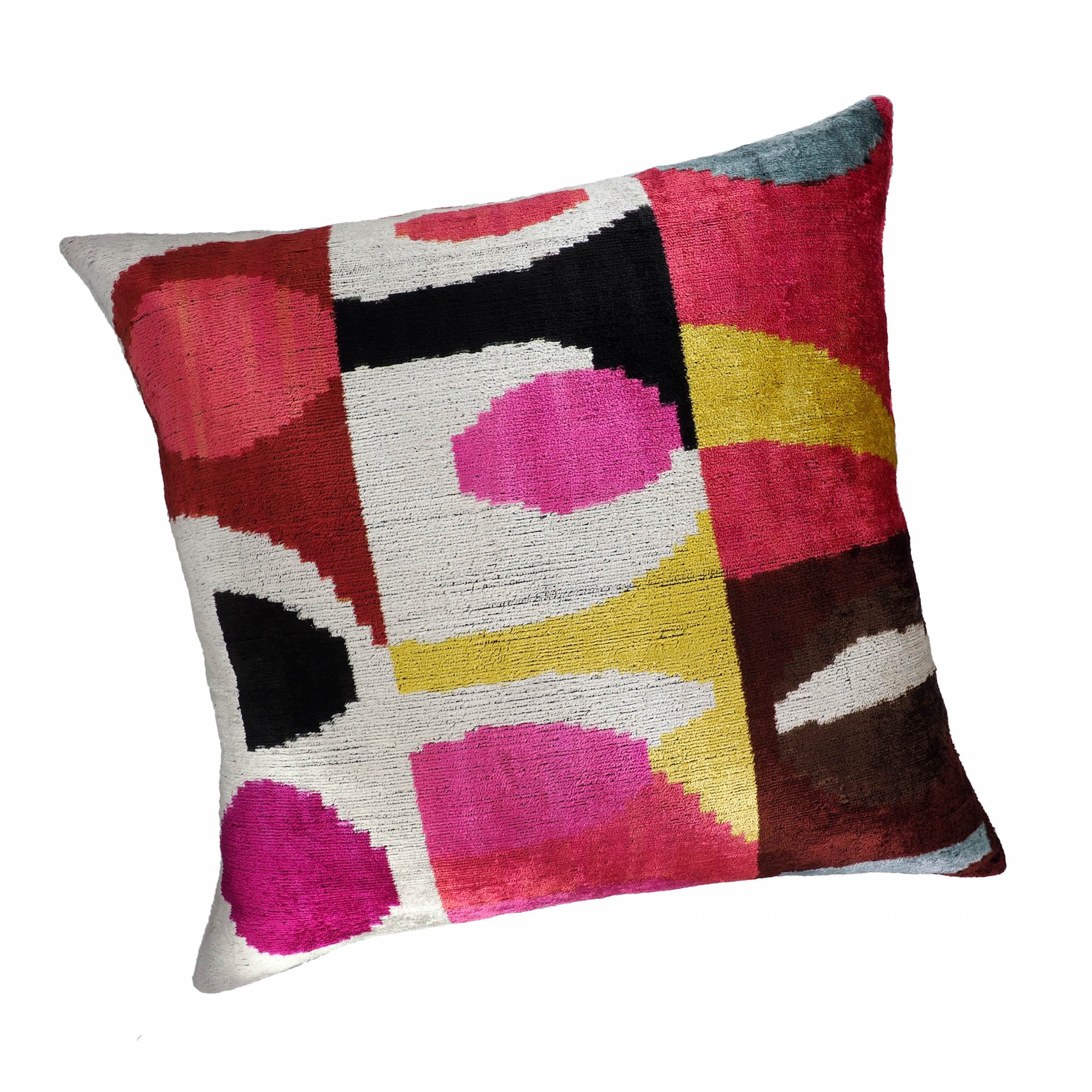 Chouchou Touch 24-inch ikat pillow with bold pink, yellow, white, and burgundy color blocks.