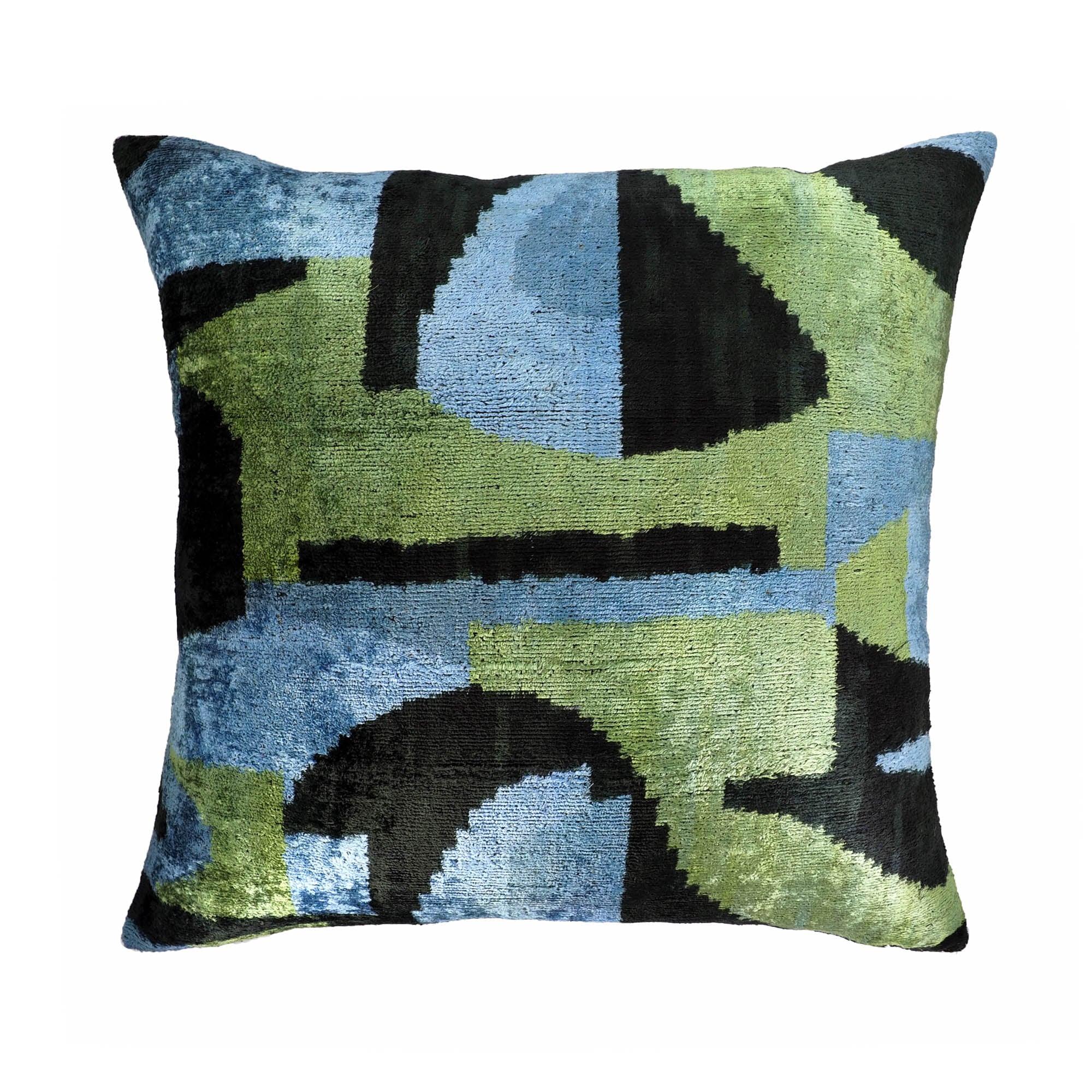 Square silk velvet pillow in abstract green, blue, and black ikat pattern with modern artistic shapes.