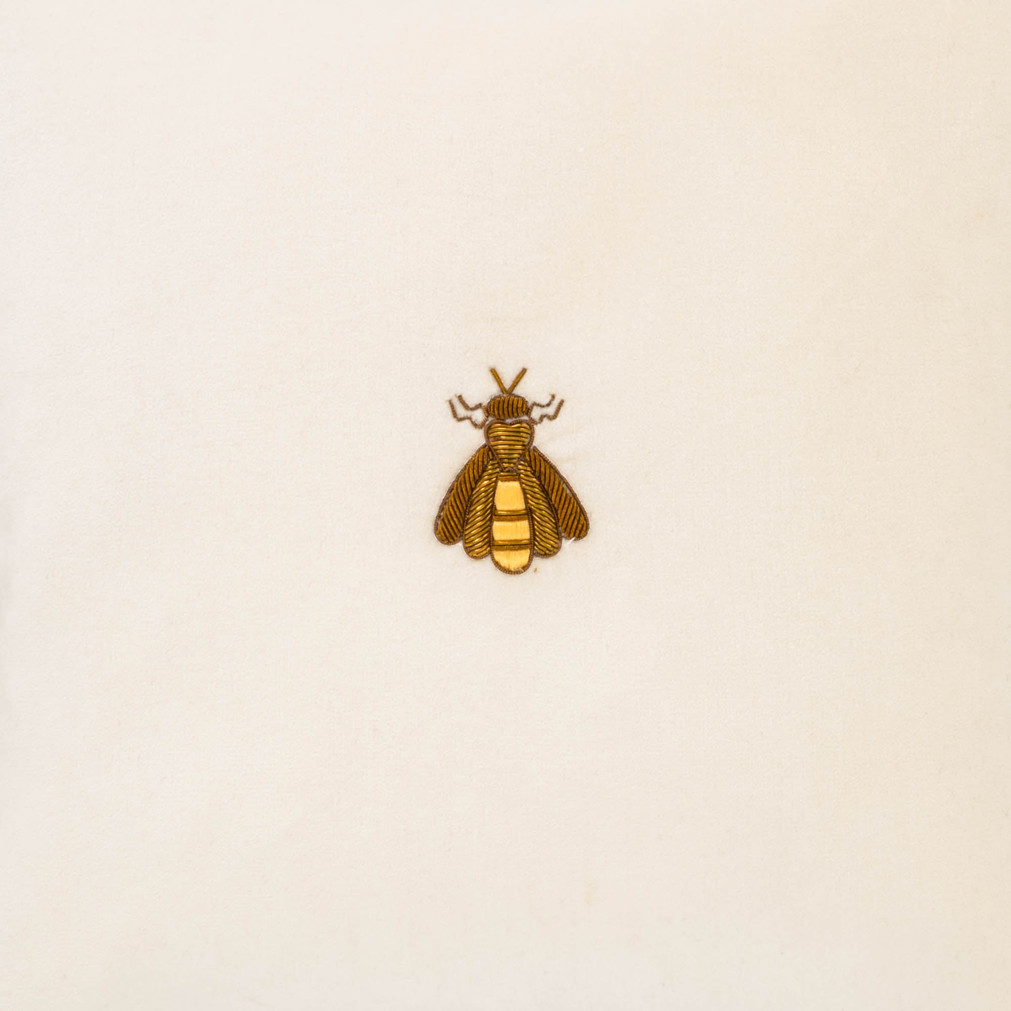 Chouchou Touch 12" x 12" White Bee Pillow, crafted with golden metal thread embroidery for a timeless and sophisticated accent.