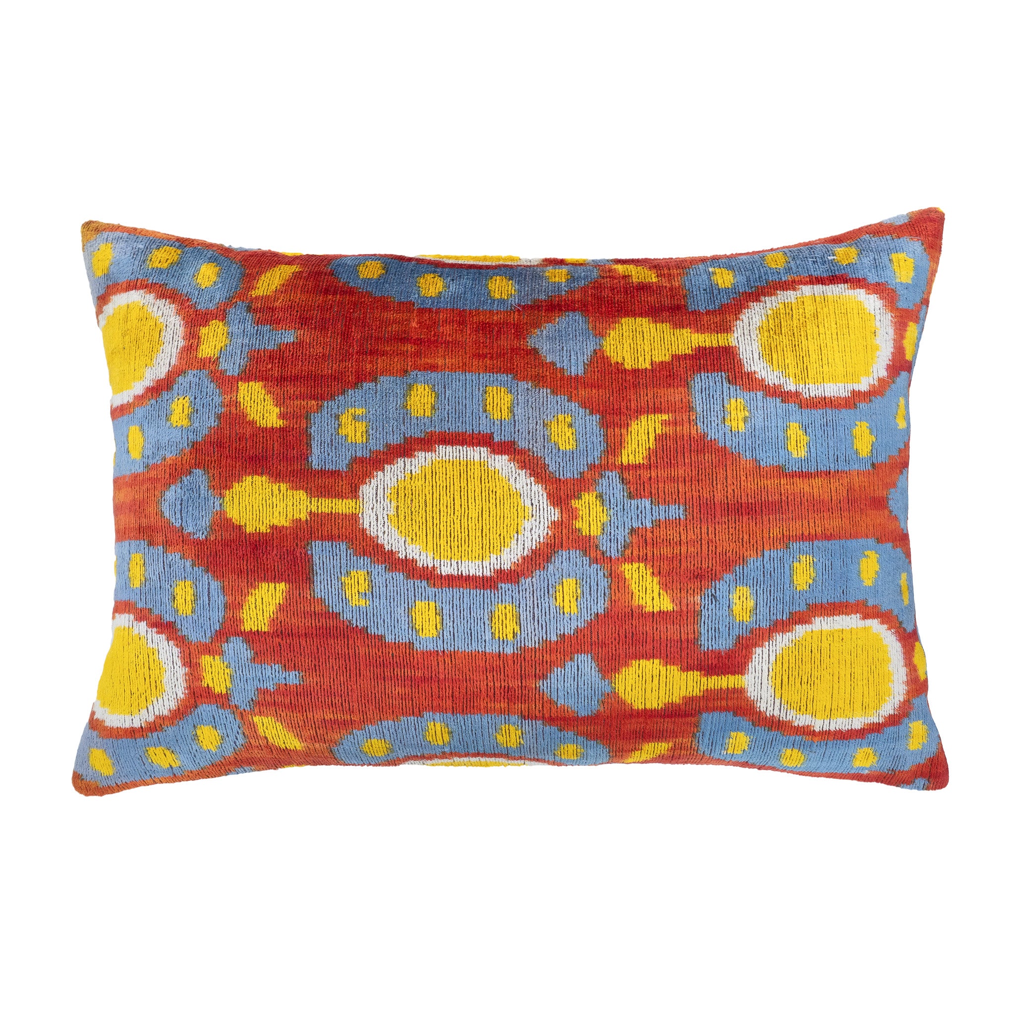 Blossoms Silk Velvet Ikat Throw Pillow with a vibrant floral-inspired pattern in red, yellow, and blue.