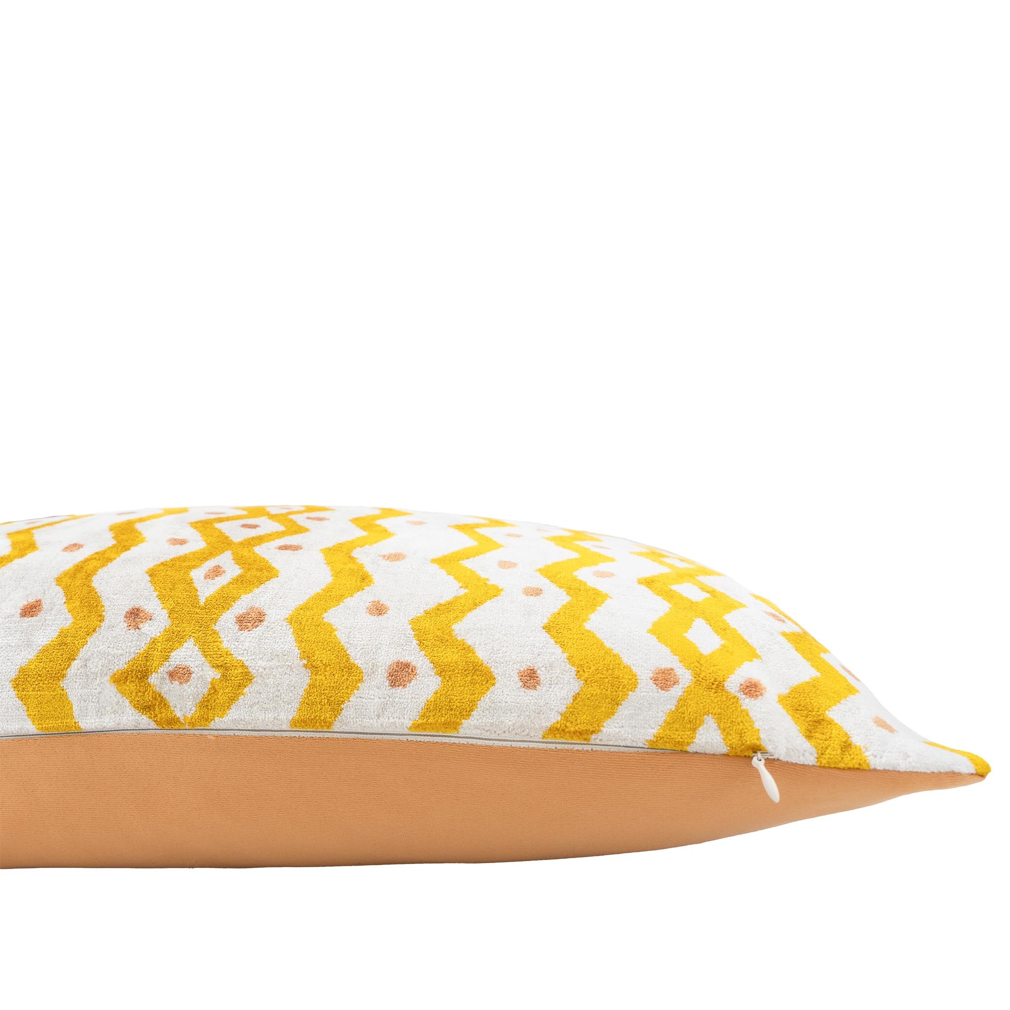 Casablanca-style ikat pillow featuring warm yellow zigzag motifs on a creamy white base.