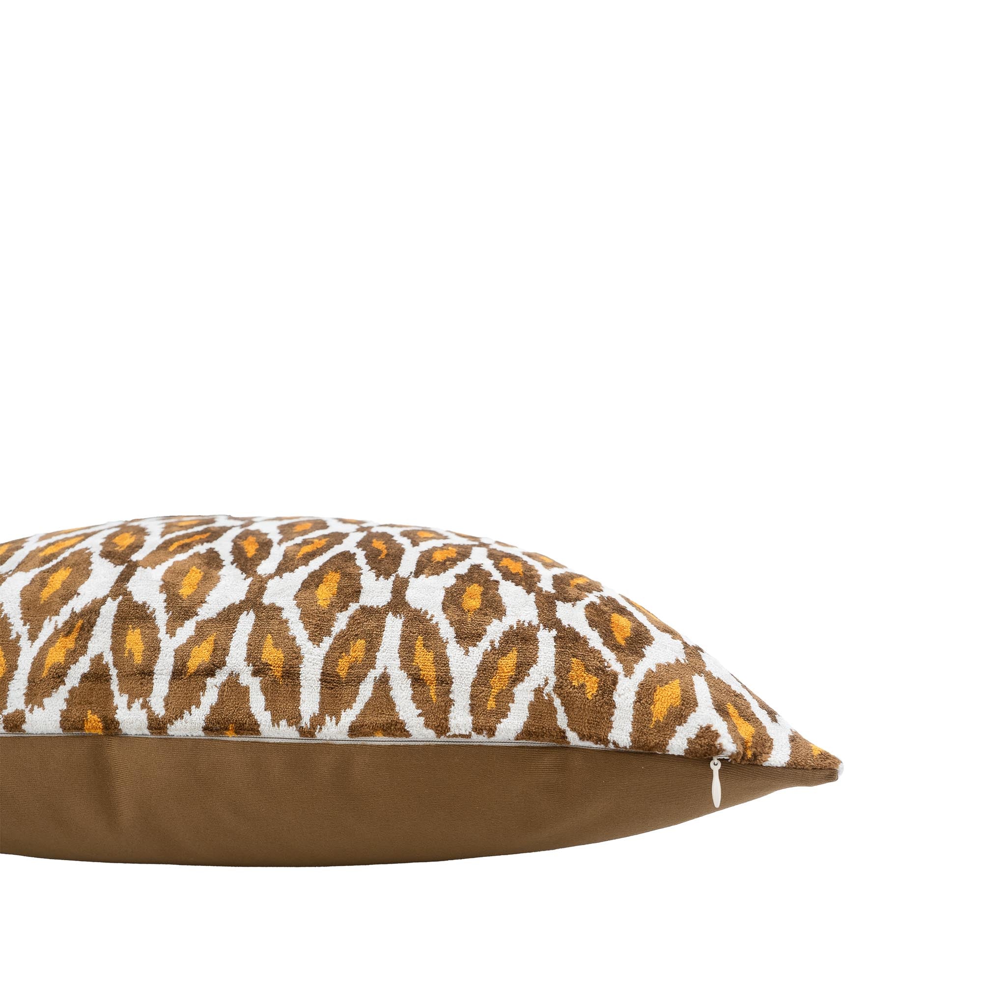 Chouchou Touch 20x20 ikat throw pillow featuring amber and brown geometric pattern.