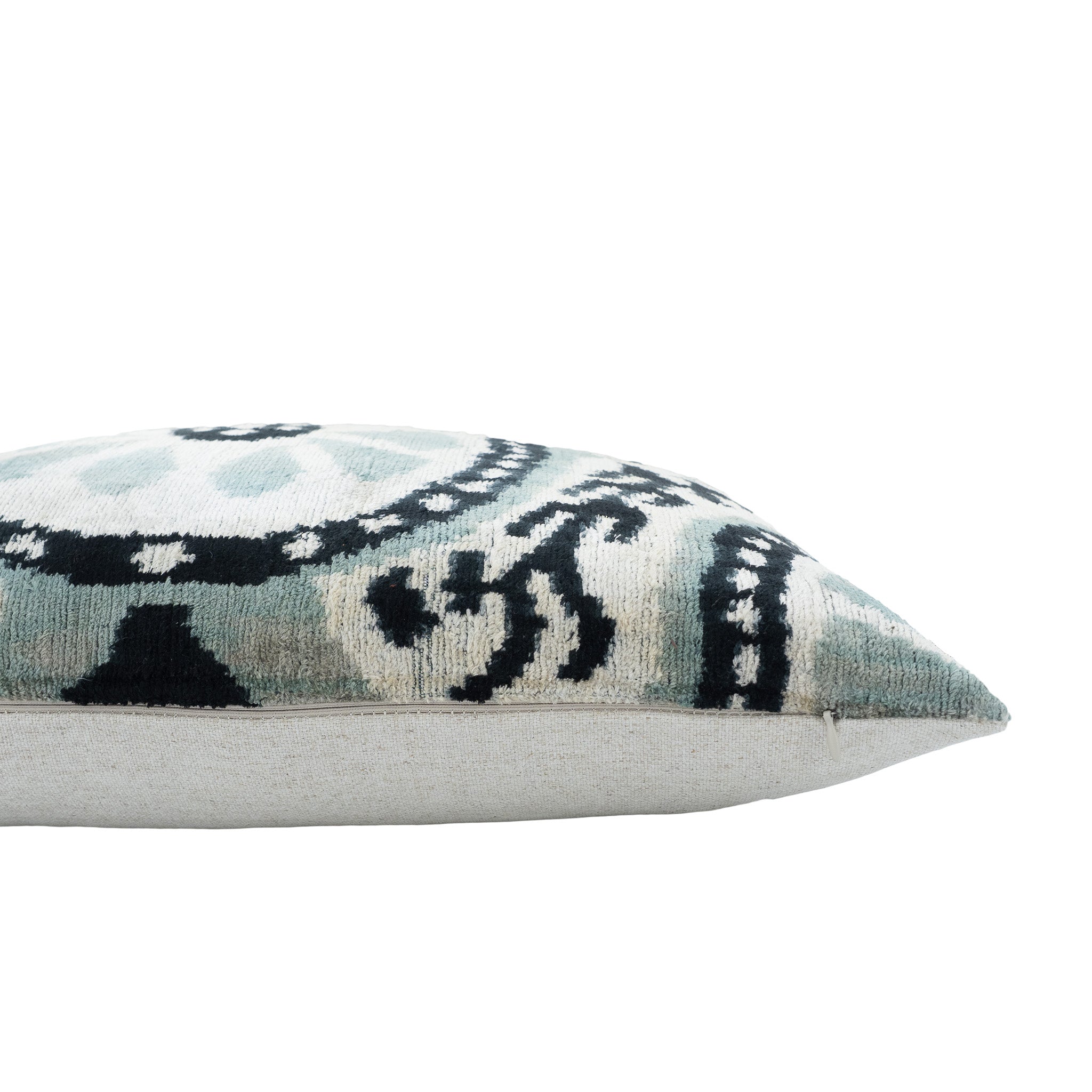 Rectangular 16x24 ikat throw pillow in soft blue, ivory, and black with linen backing.