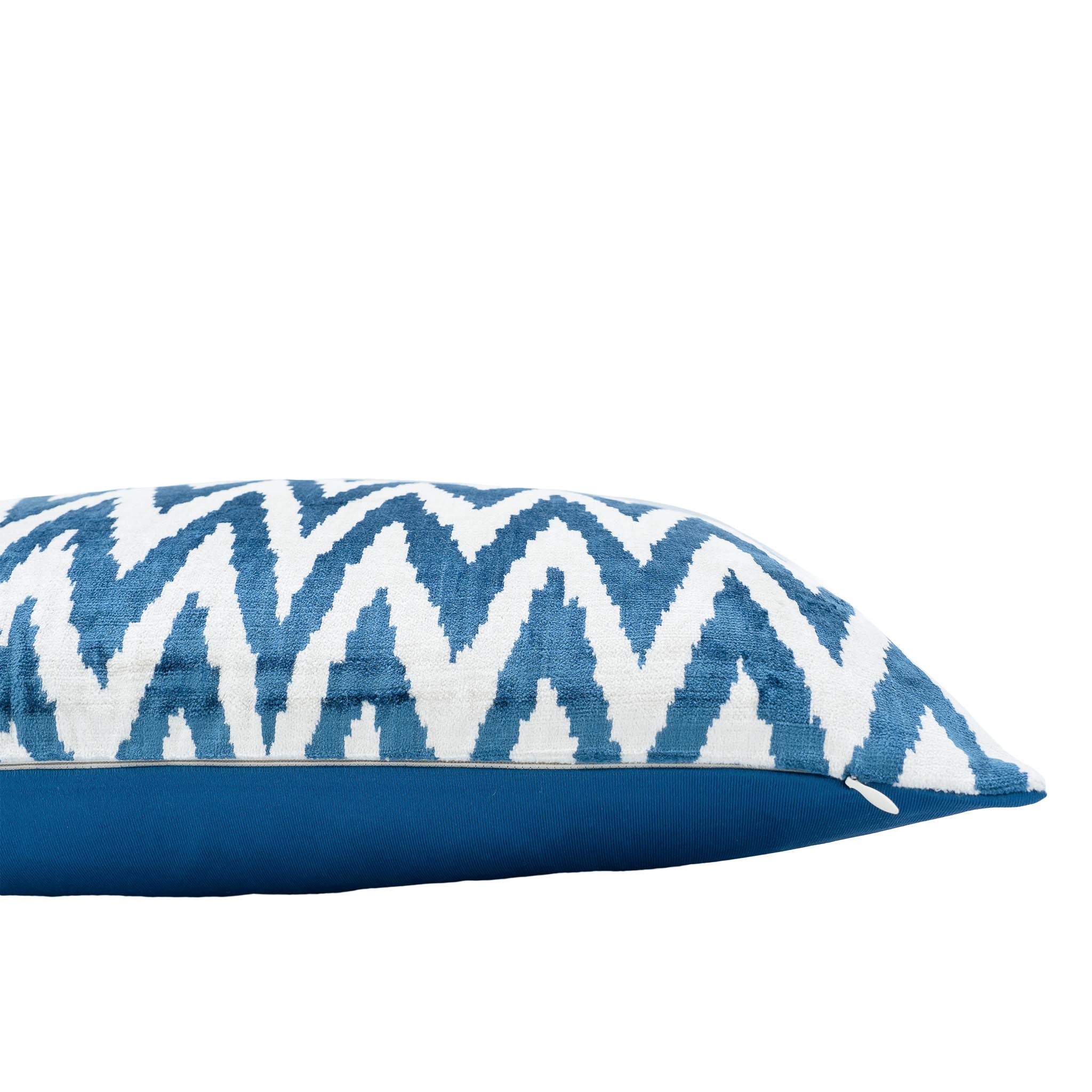 Handwoven silk velvet ikat pillow with zigzag chevron design in deep blue.