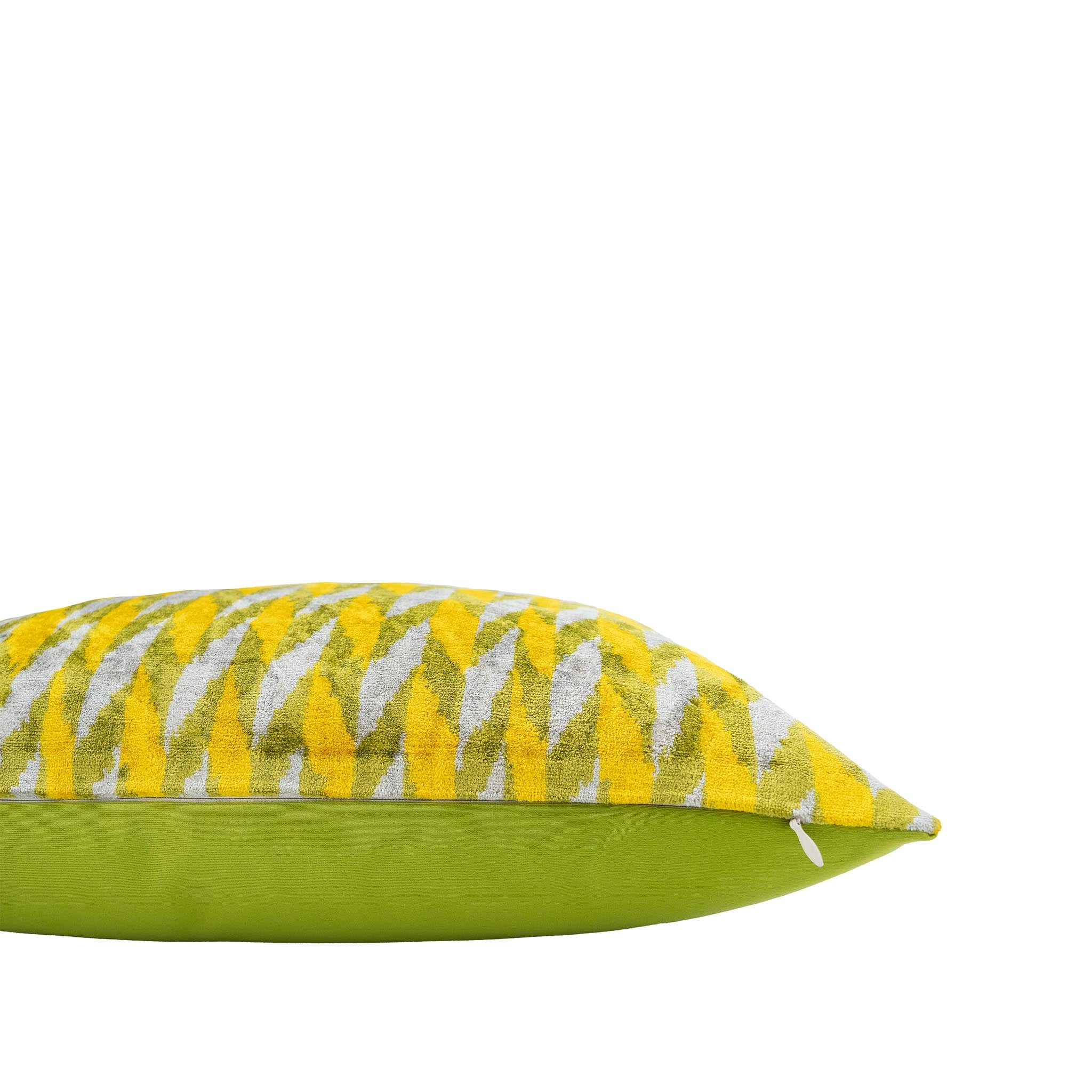 Vivid yellow and green decorative pillow with chevron design, ideal for modern interiors.