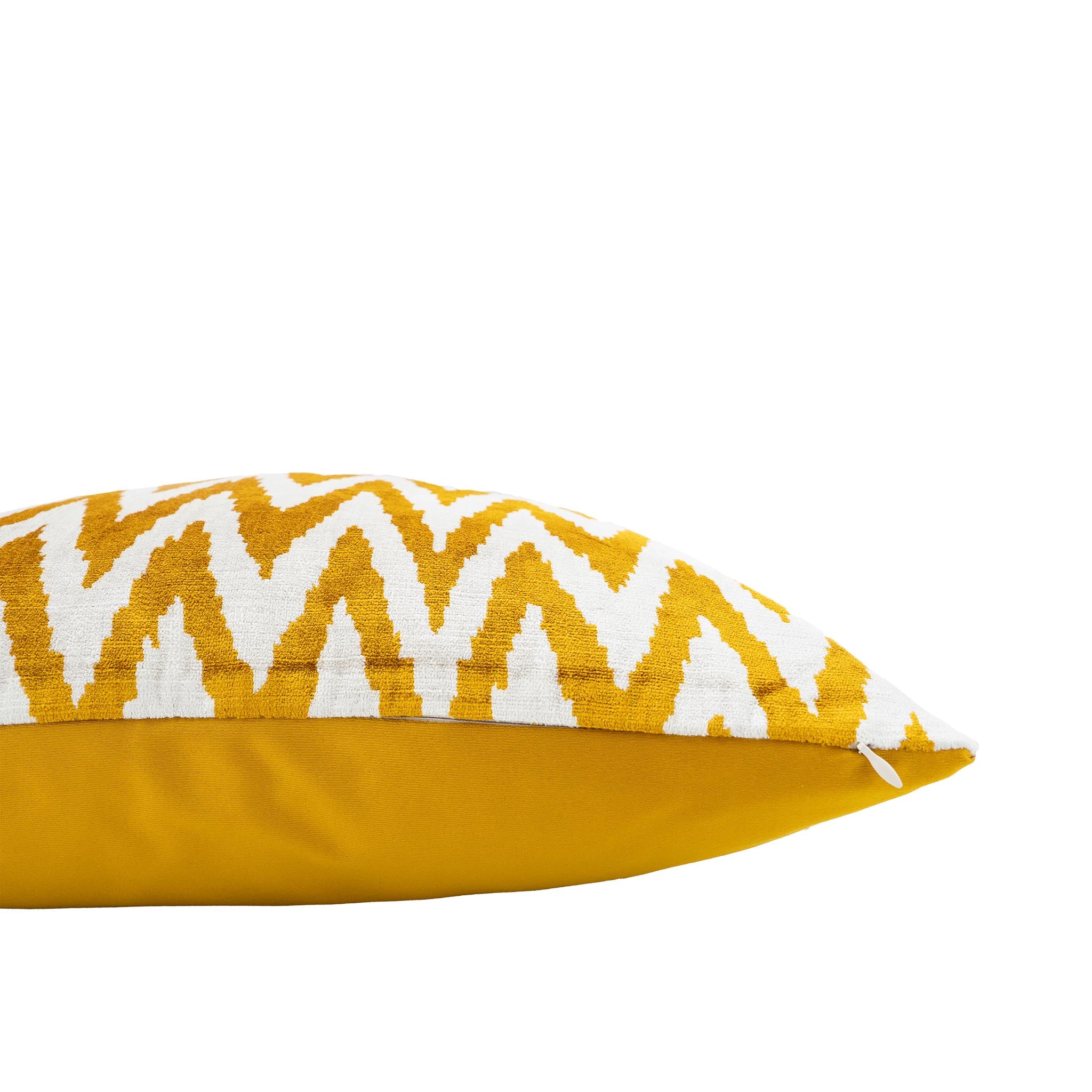 Handwoven silk velvet ikat pillow featuring a vibrant yellow and white chevron design.