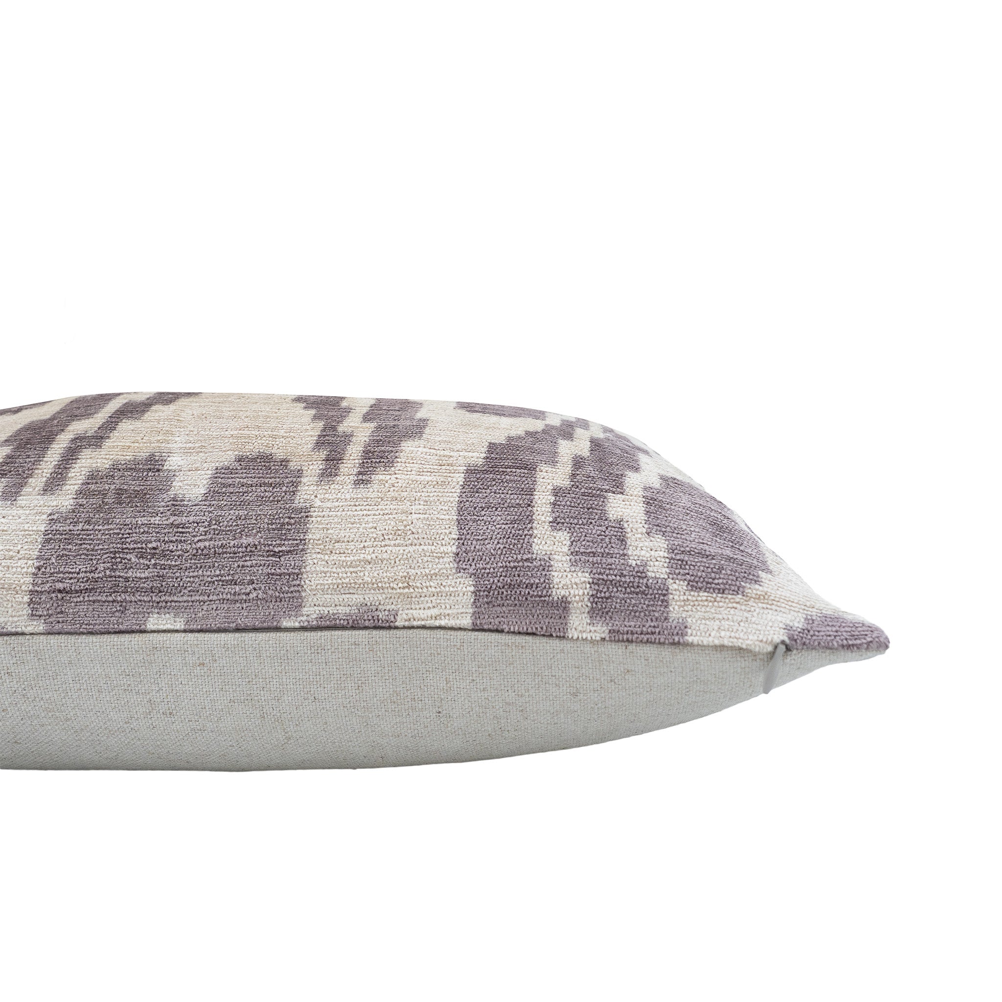 Handwoven silk velvet ikat pillow with a subtle taupe and ivory design, adding a refined and elegant touch to any decor.