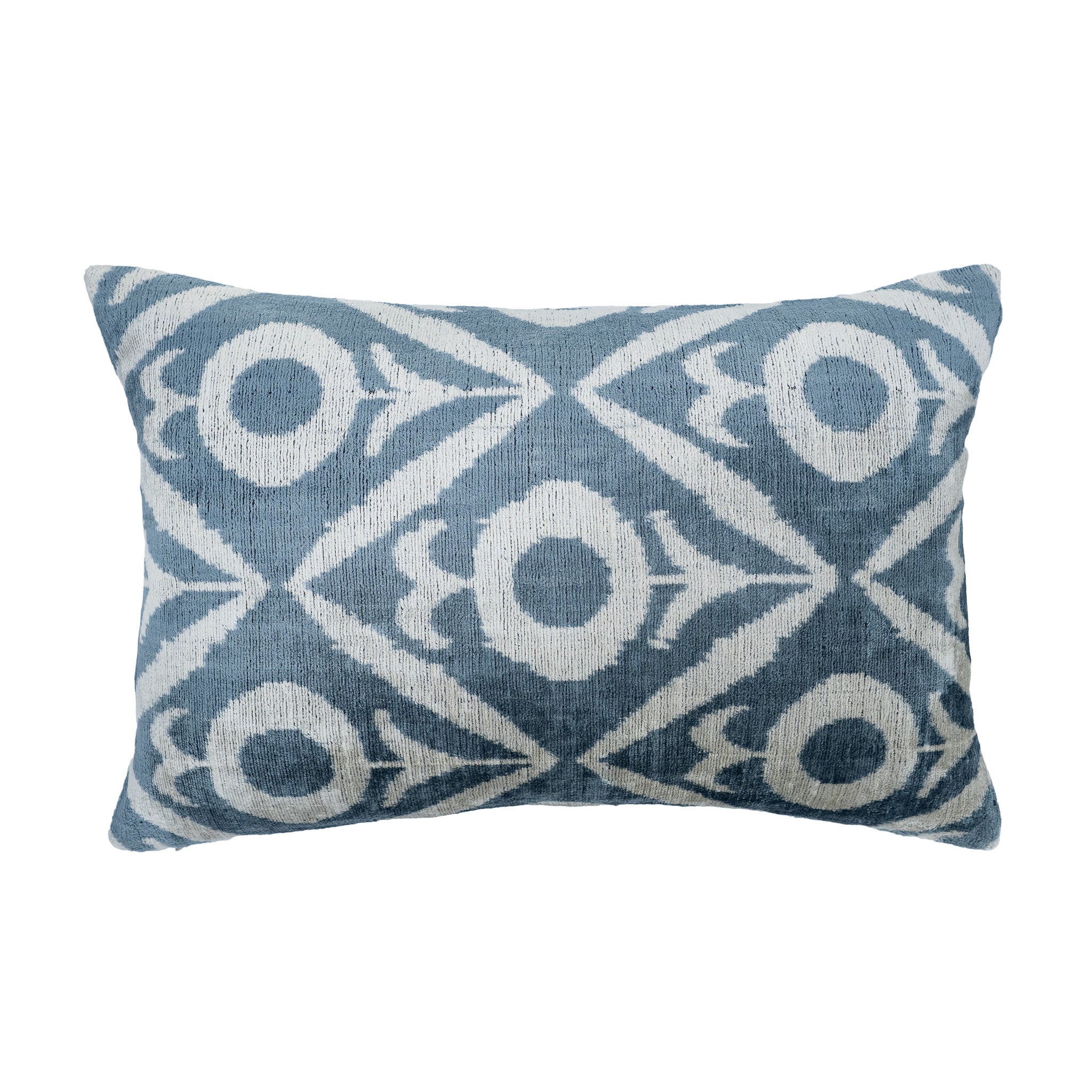 Floris blue and white silk velvet ikat pillow with circular floral pattern.