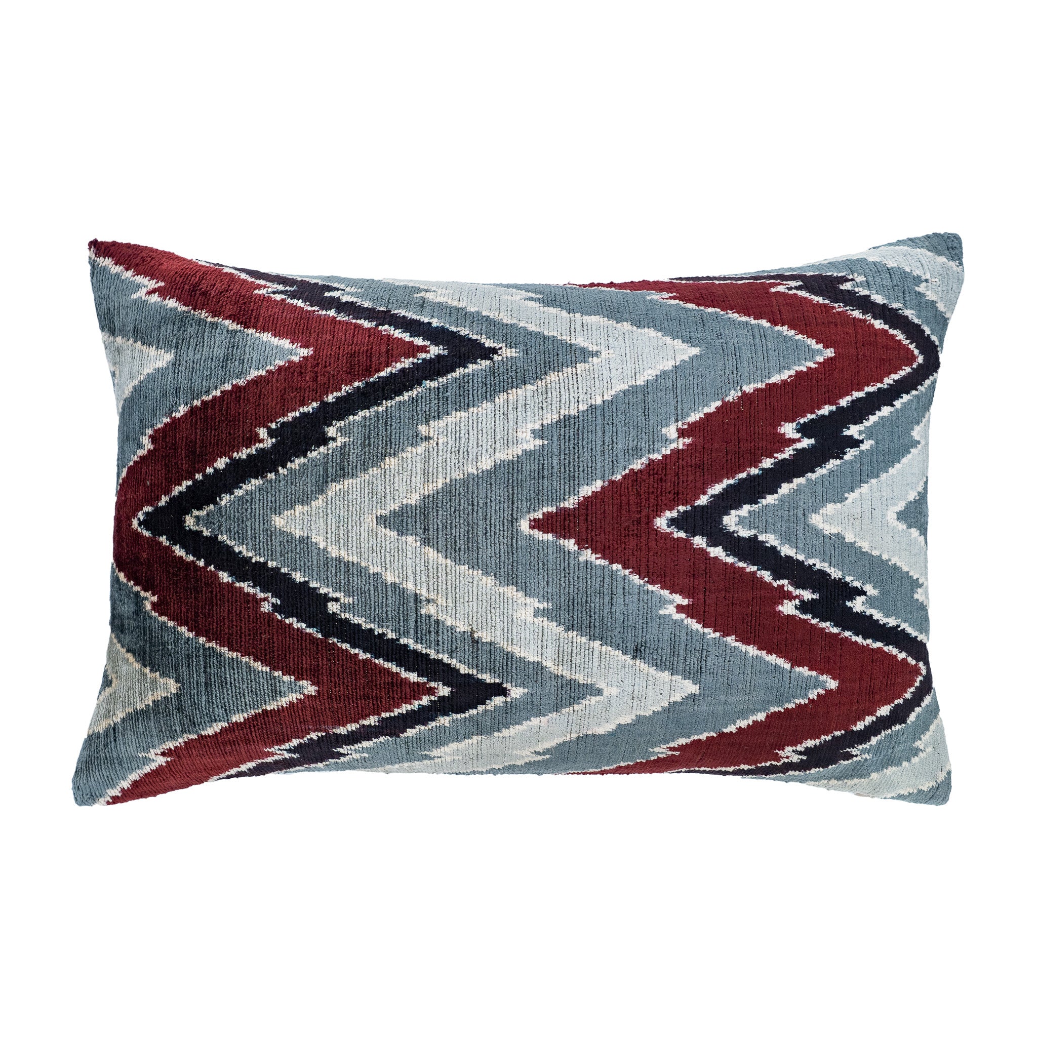 Flow ikat pillow with zigzag pattern in red, black, and soft blue silk velvet.