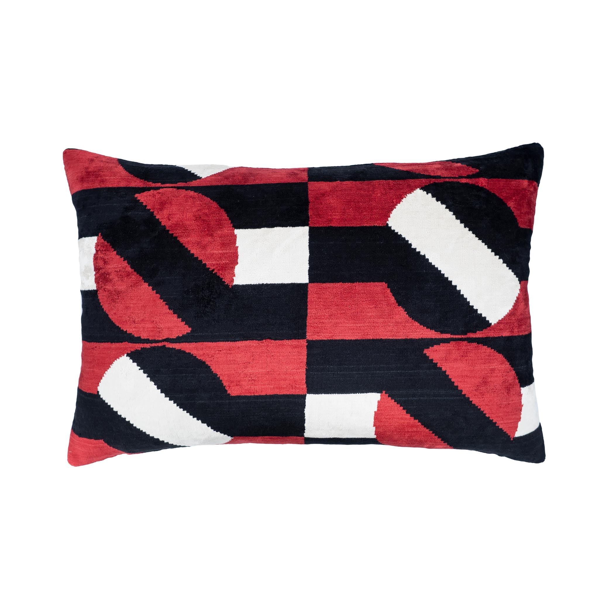 Rectangular red, black, and white silk velvet ikat pillow with abstract geometric design.