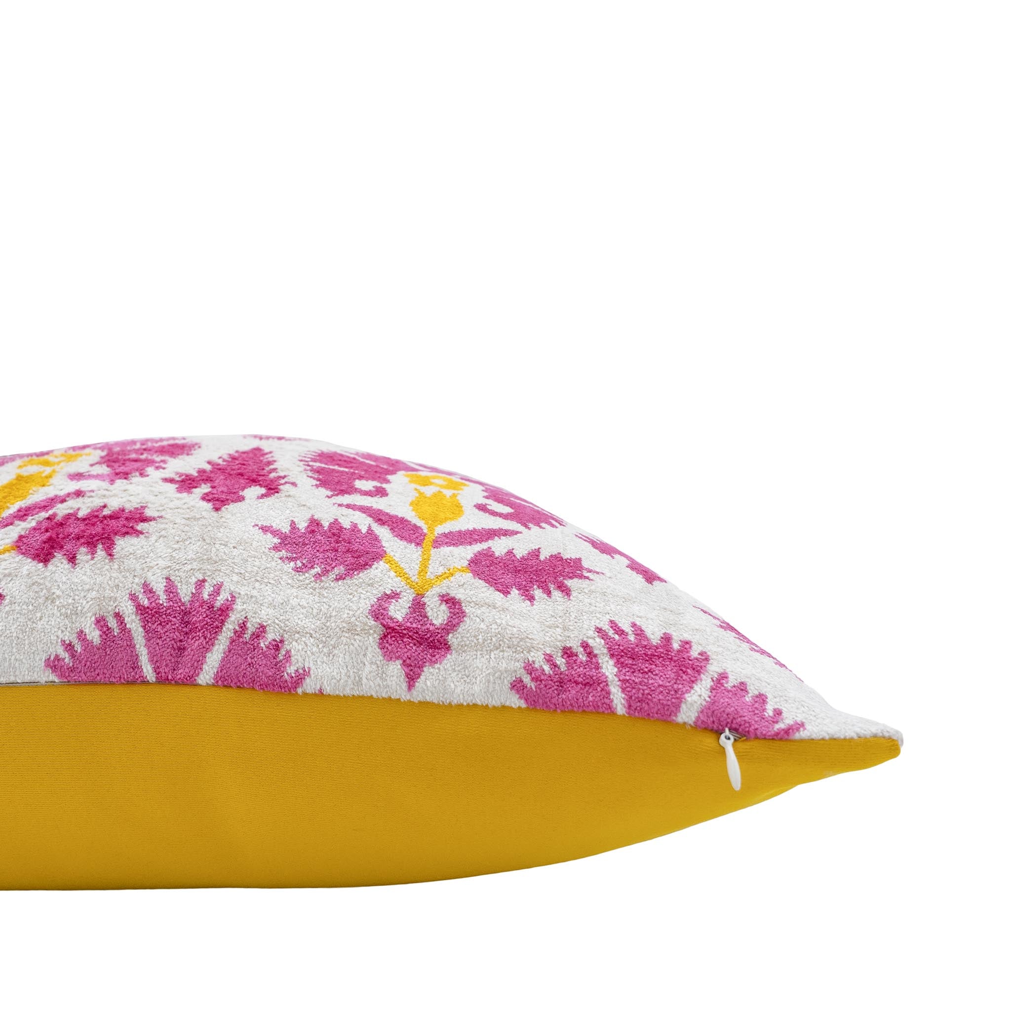 Chouchou Touch silk velvet ikat pillow featuring an intricate magenta and yellow floral pattern inspired by traditional Ottoman designs.