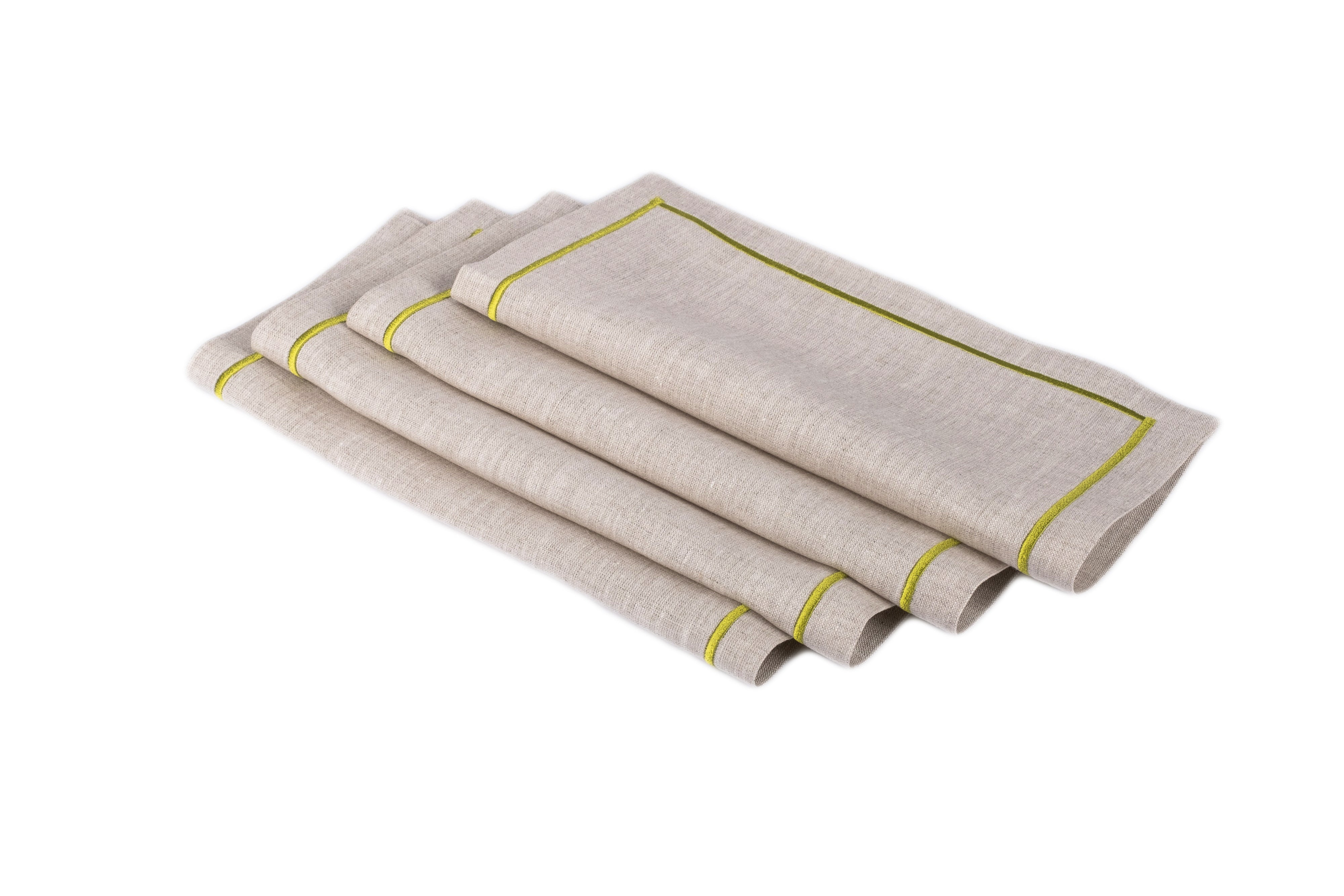 Luxurious linen cocktail napkins with embroidered edges, designed to add a refined touch to any dining occasion.