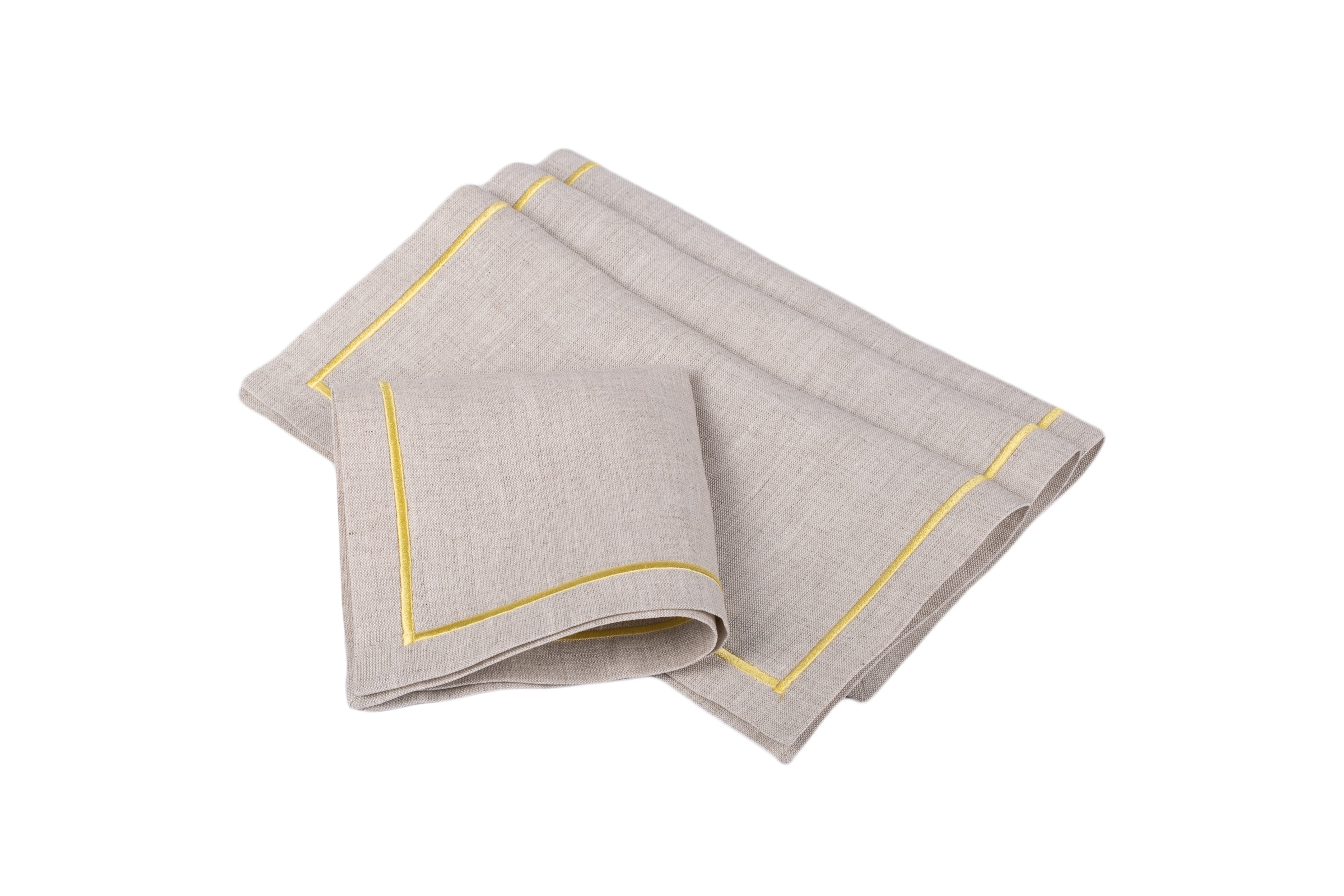 Linen cocktail napkins with embroidery borders, crafted to bring color and sophistication to your table settings.