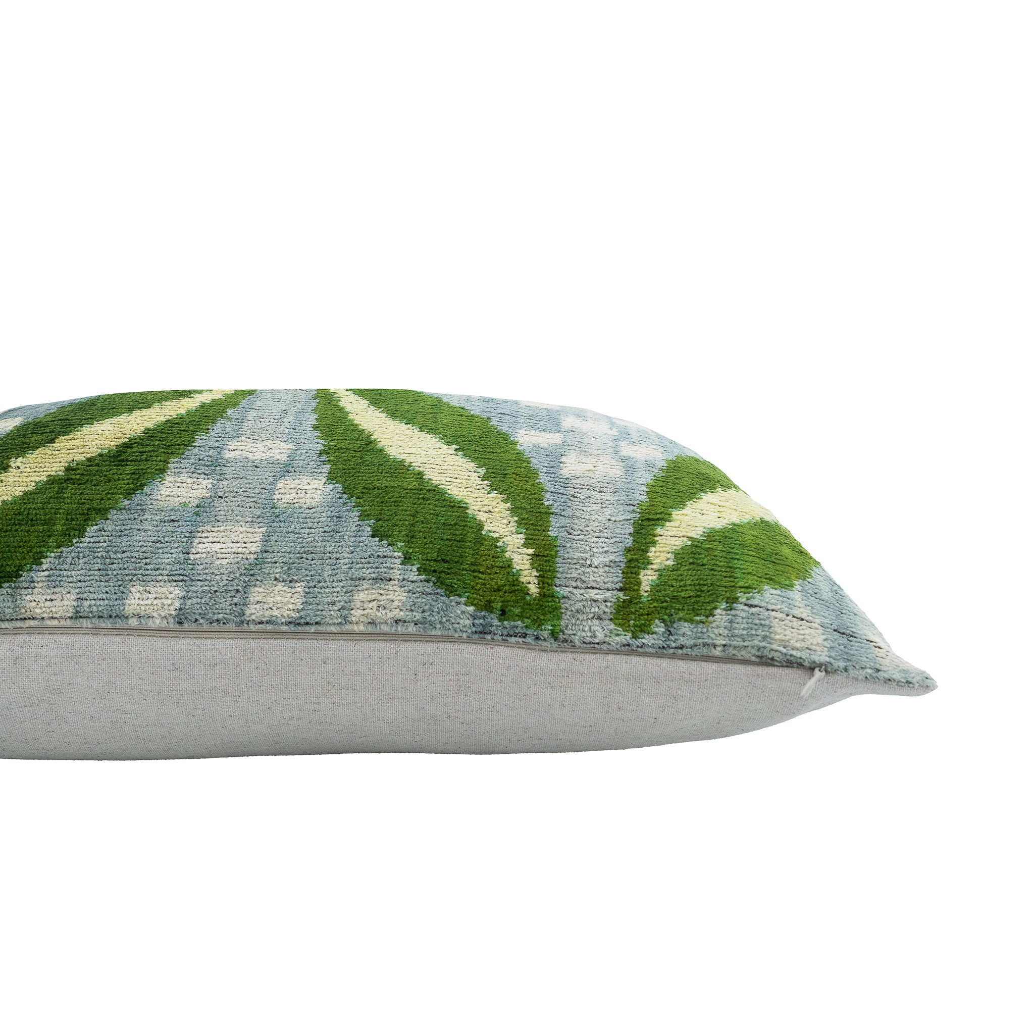 Vibrant botanical ikat pillow in pure silk velvet, merging timeless ikat weaving techniques with a fresh and modern leaf design.