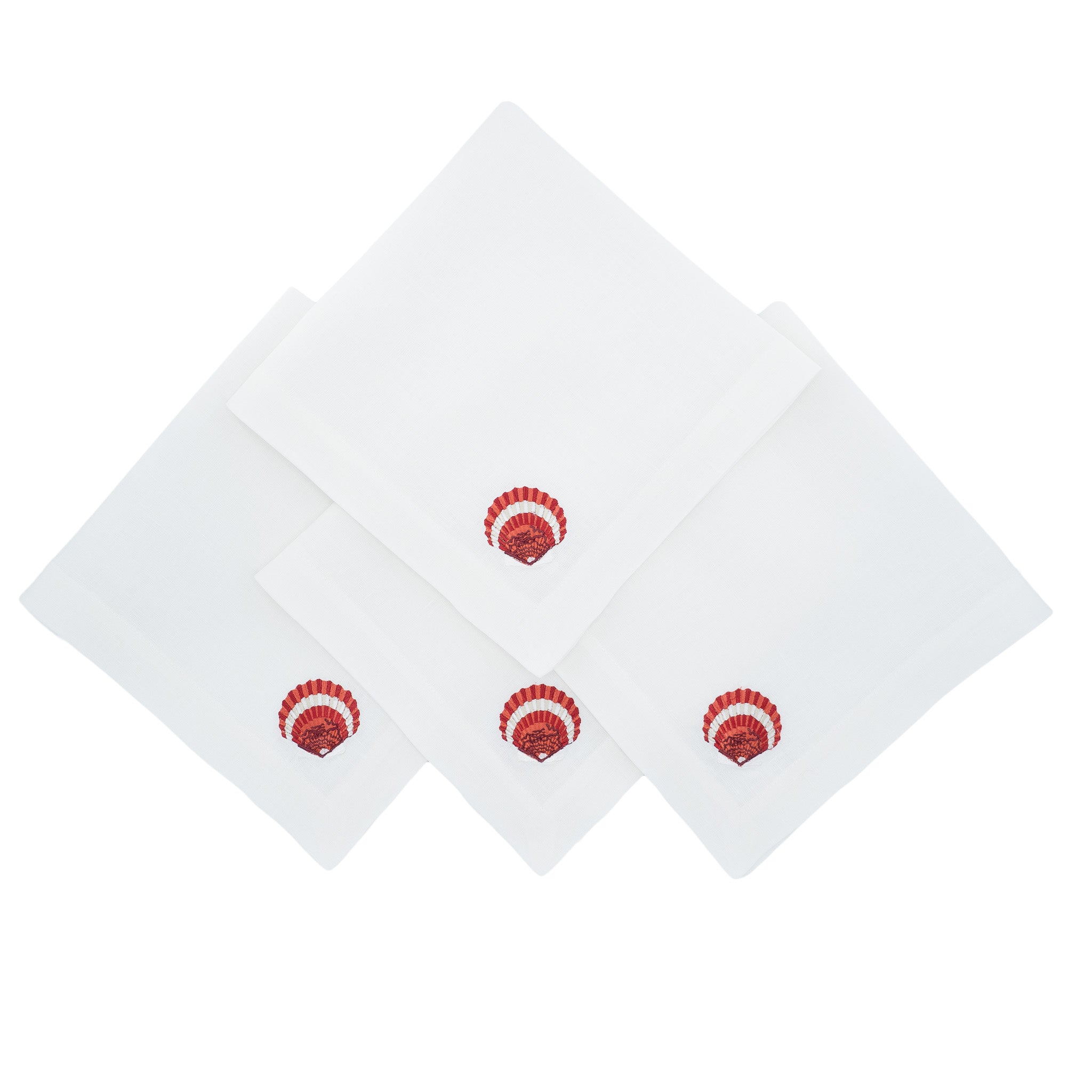Handmade linen napkins with decorative red shells, ideal for both formal events and casual family gatherings.