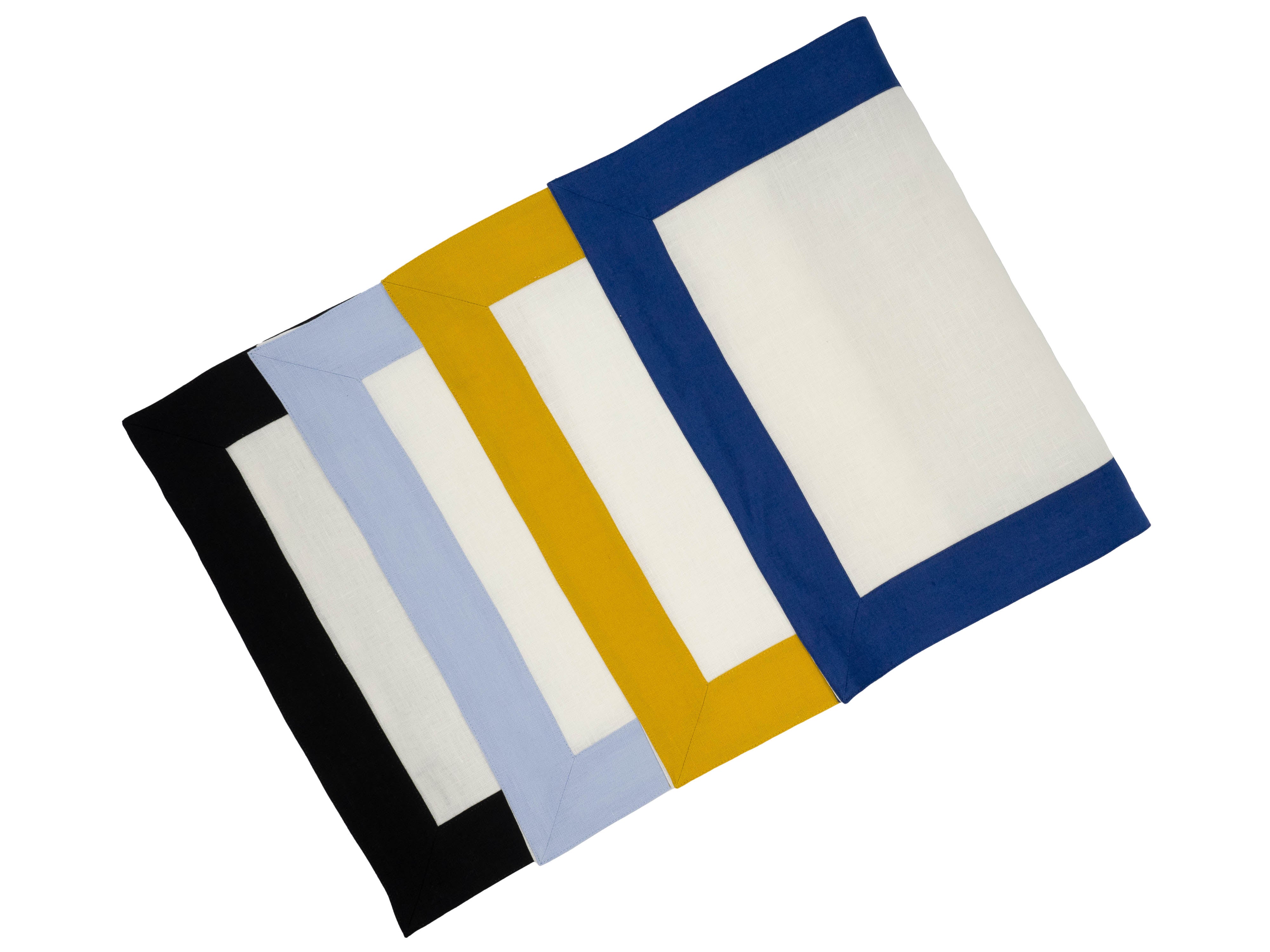 Handmade Chouchou Touch linen placemats with navy borders, set of 4, designed to enhance your tabletop for any occasion.