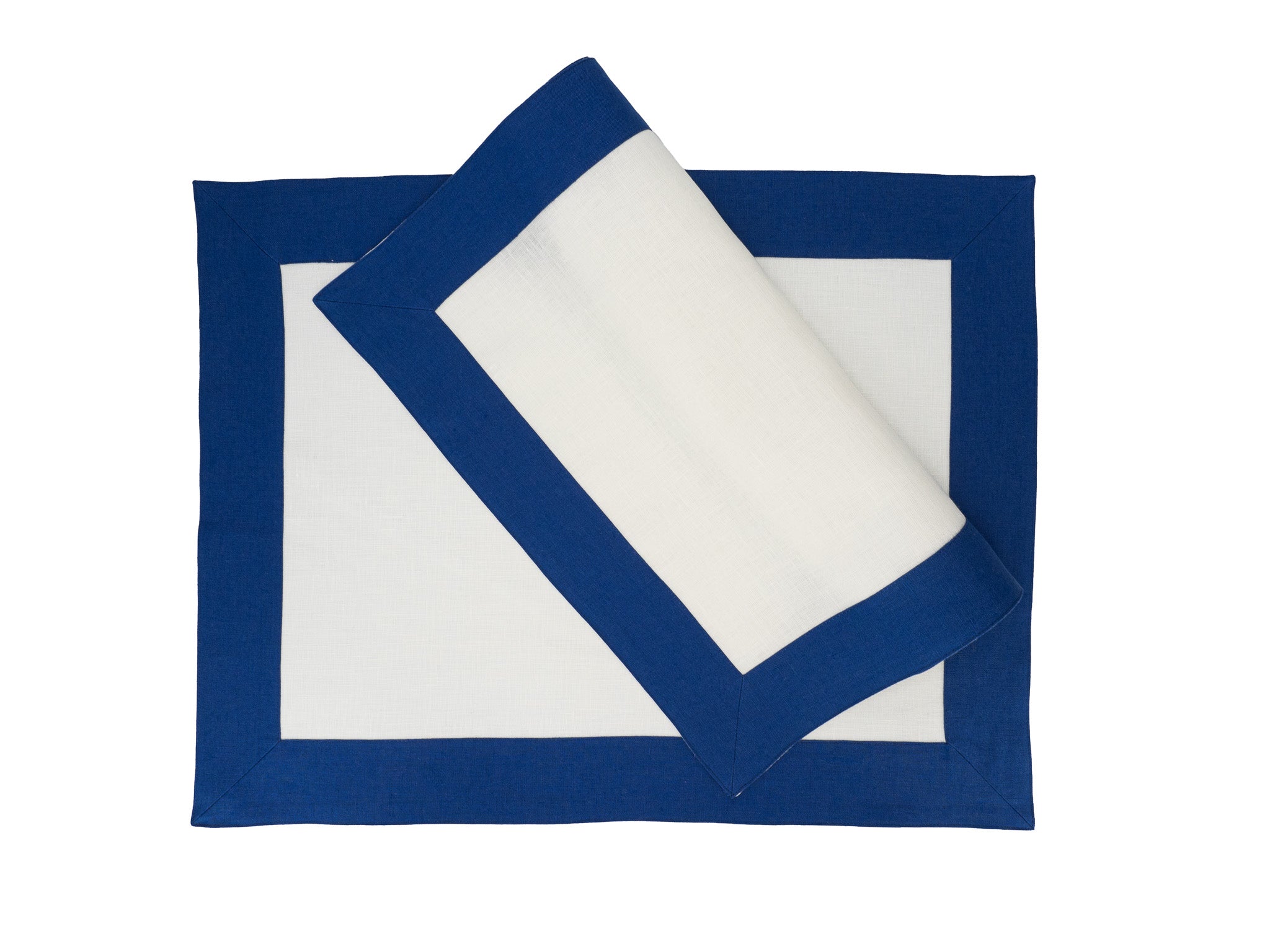 Set of 4 linen placemats with navy borders, hand crafted to provide durability and elegance for formal or casual meals.
