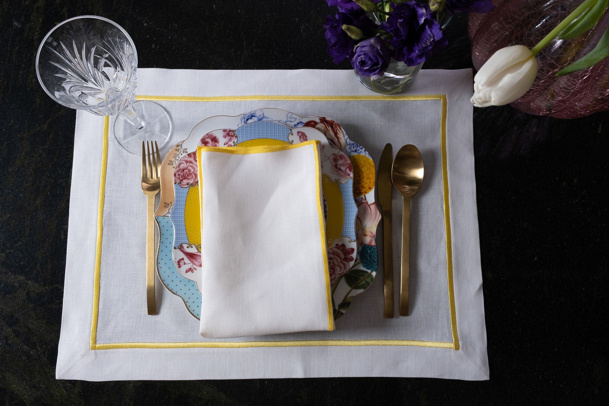 Stylish linen placemats with yellow borders, crafted by skilled artisans to provide both beauty and functionality.