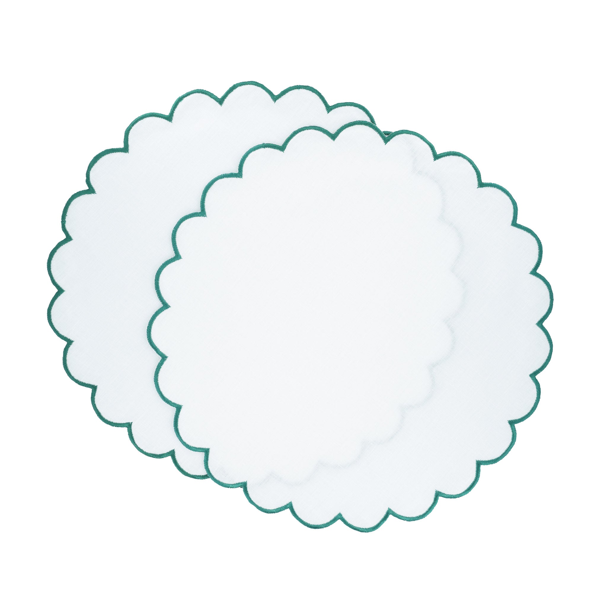 Linen scalloped placemats with green stitch borders, crafted to bring a refined and fresh feel to your table.