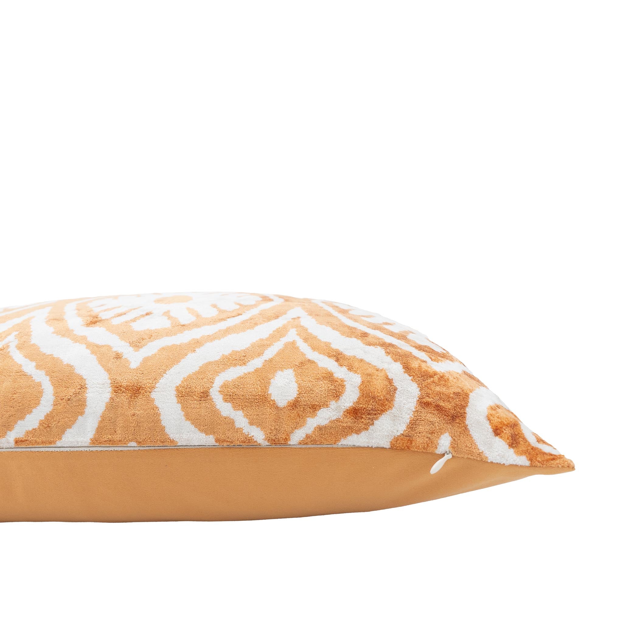 Chouchou Touch Mariana ikat throw pillow in amber and ivory silk velvet.