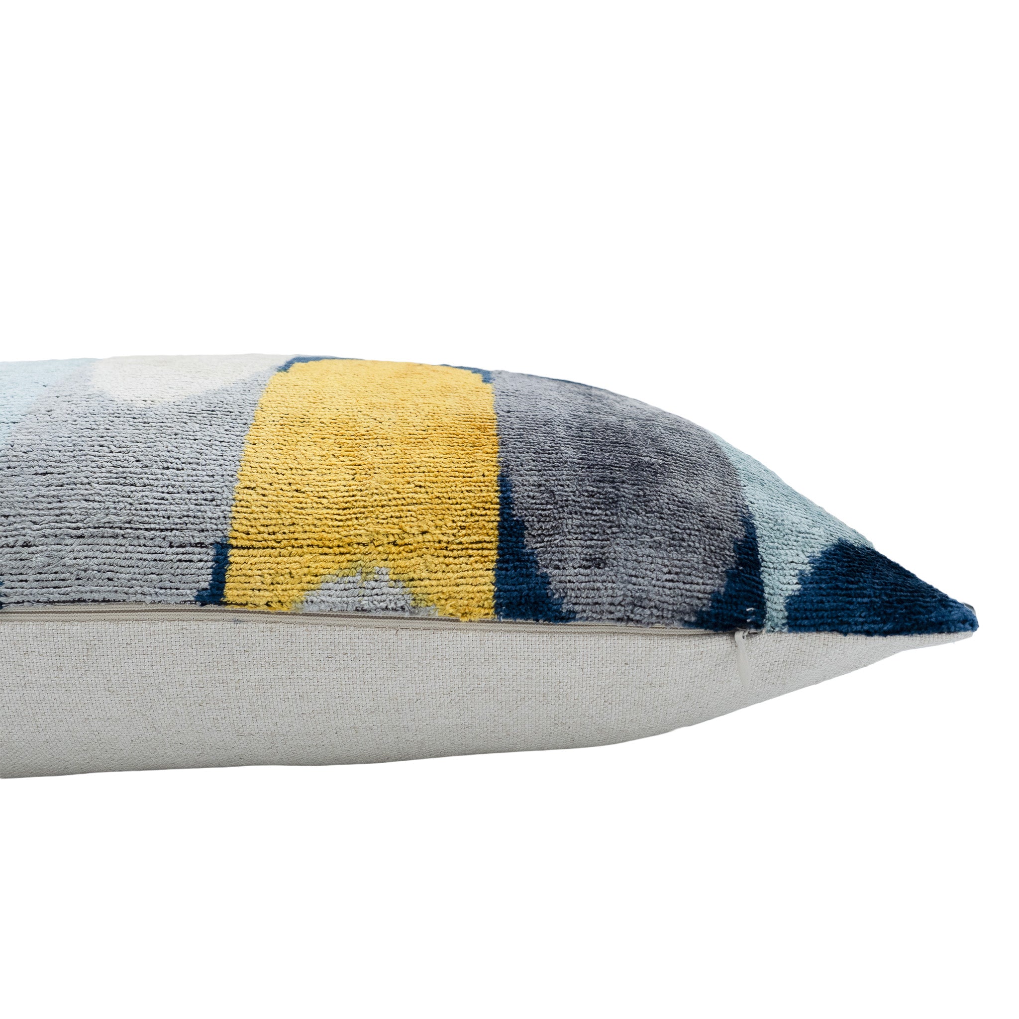 Handwoven 16x24-inch silk velvet ikat pillow featuring abstract circular and linear designs.