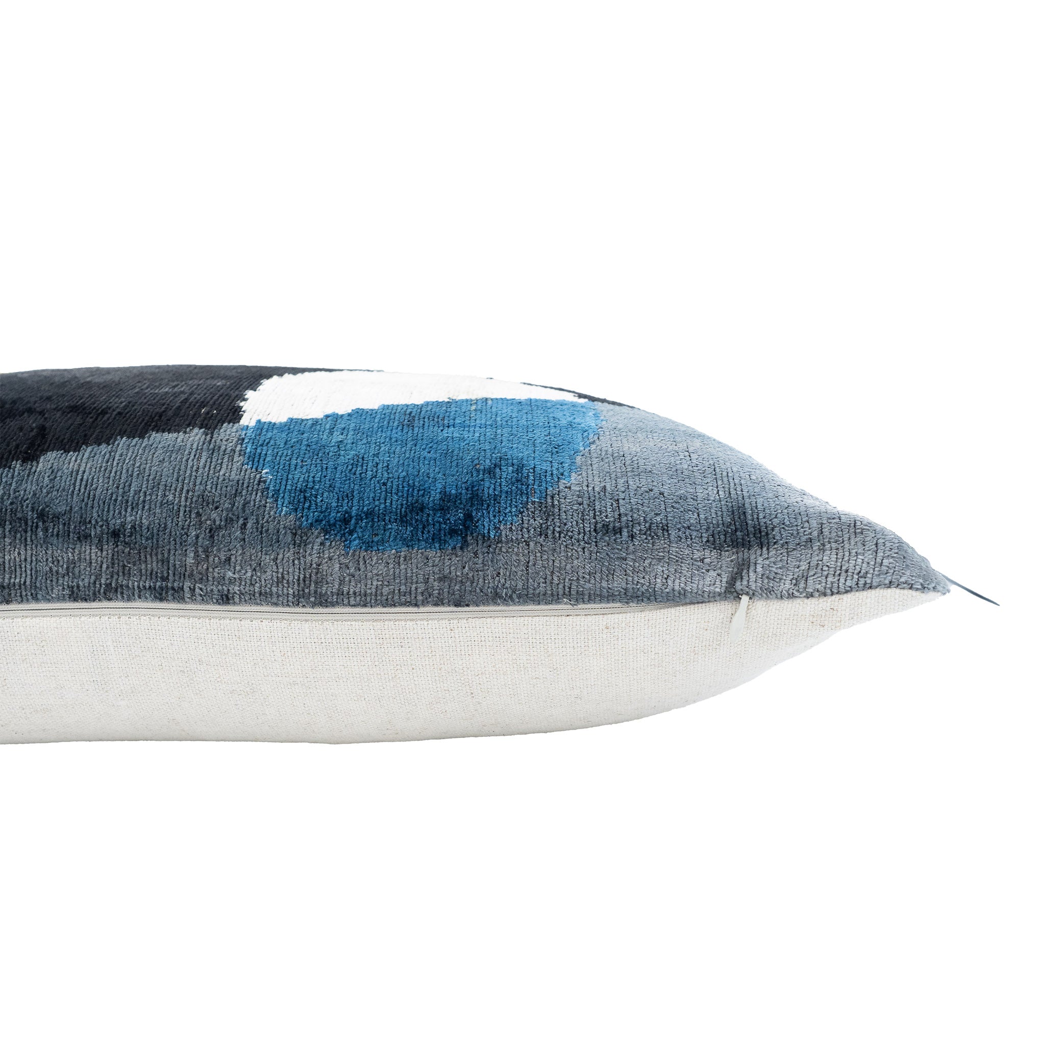 Handwoven silk velvet ikat pillow in modern Milan design, featuring bold shapes and contemporary hues.