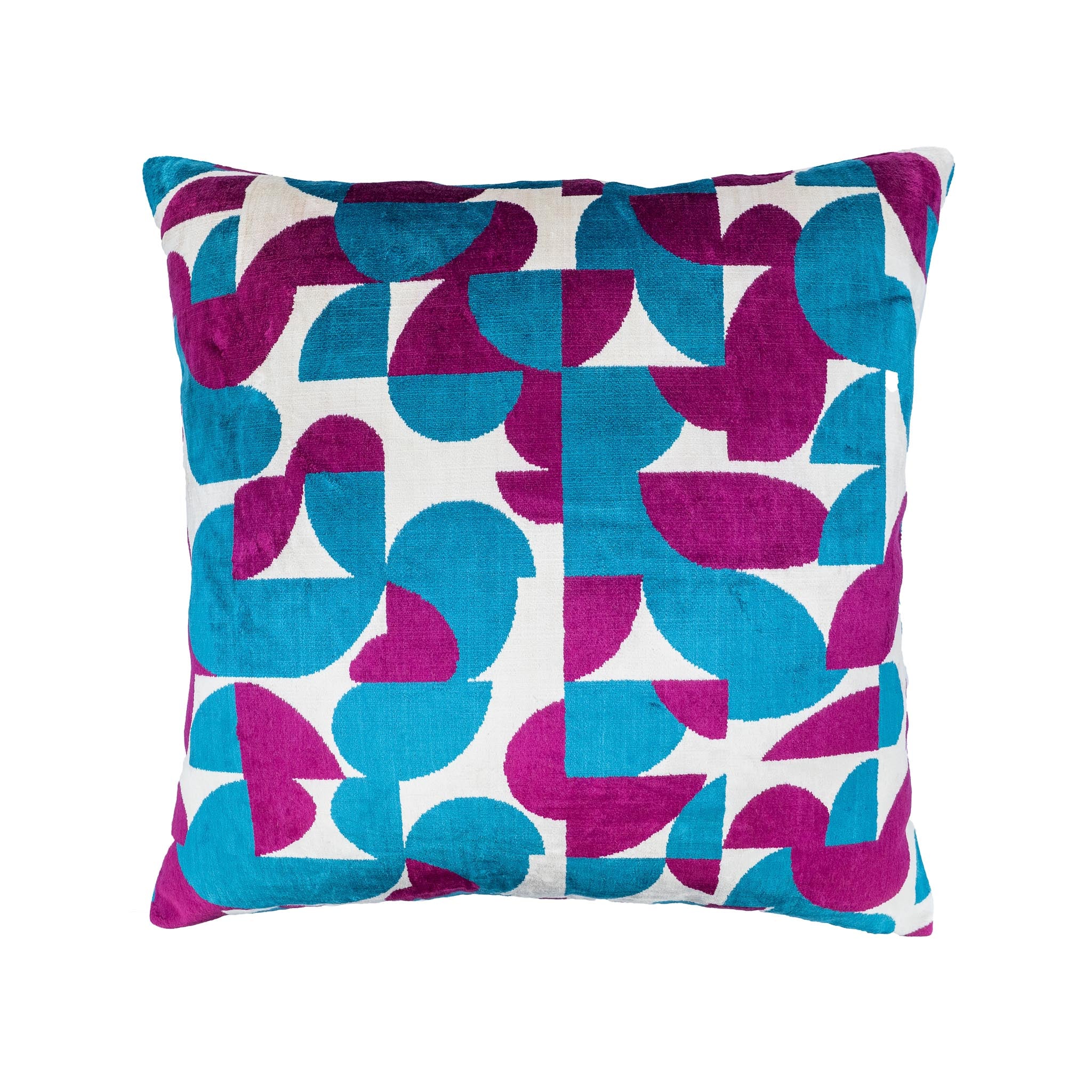 Luxury silk velvet pillow featuring an abstract ikat pattern in vibrant blue and purple hues.