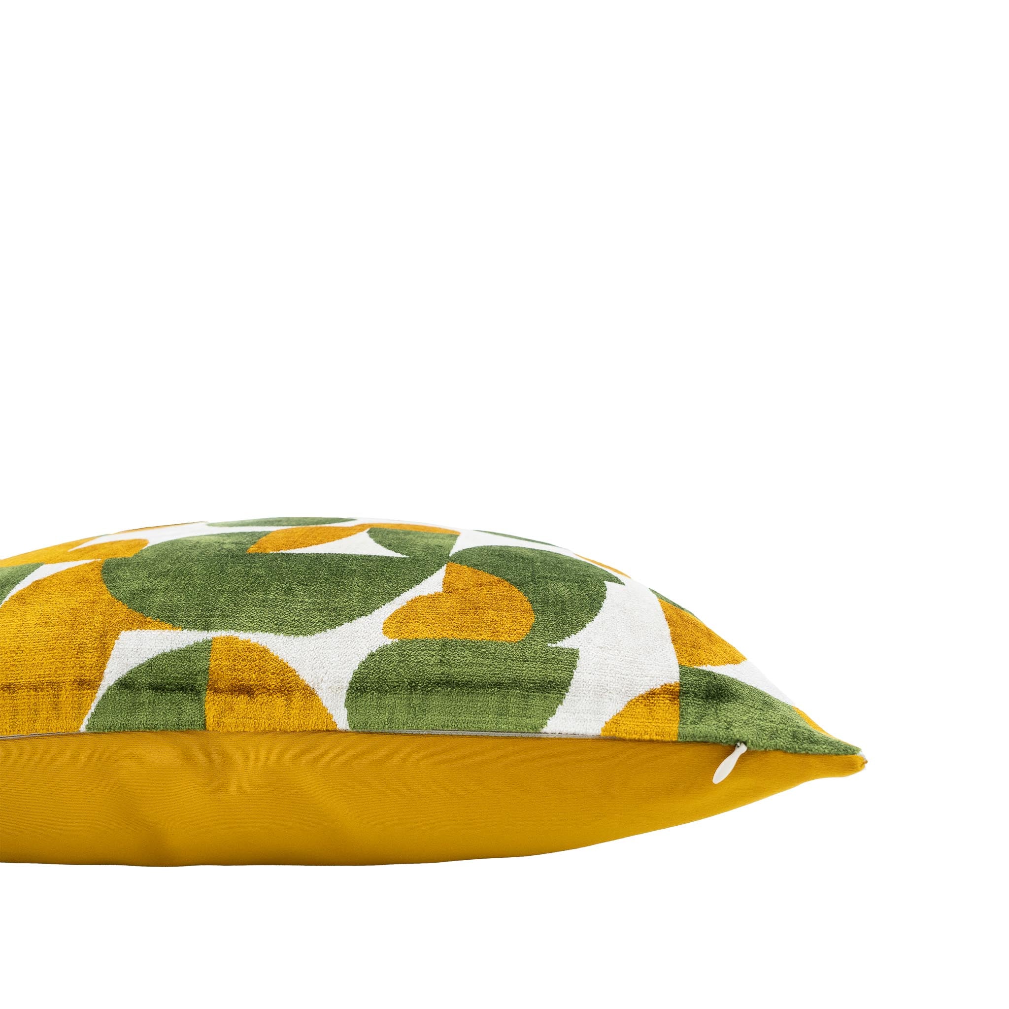 Chouchou Touch silk velvet ikat pillow featuring modern green and yellow abstract shapes, 20-inch square.