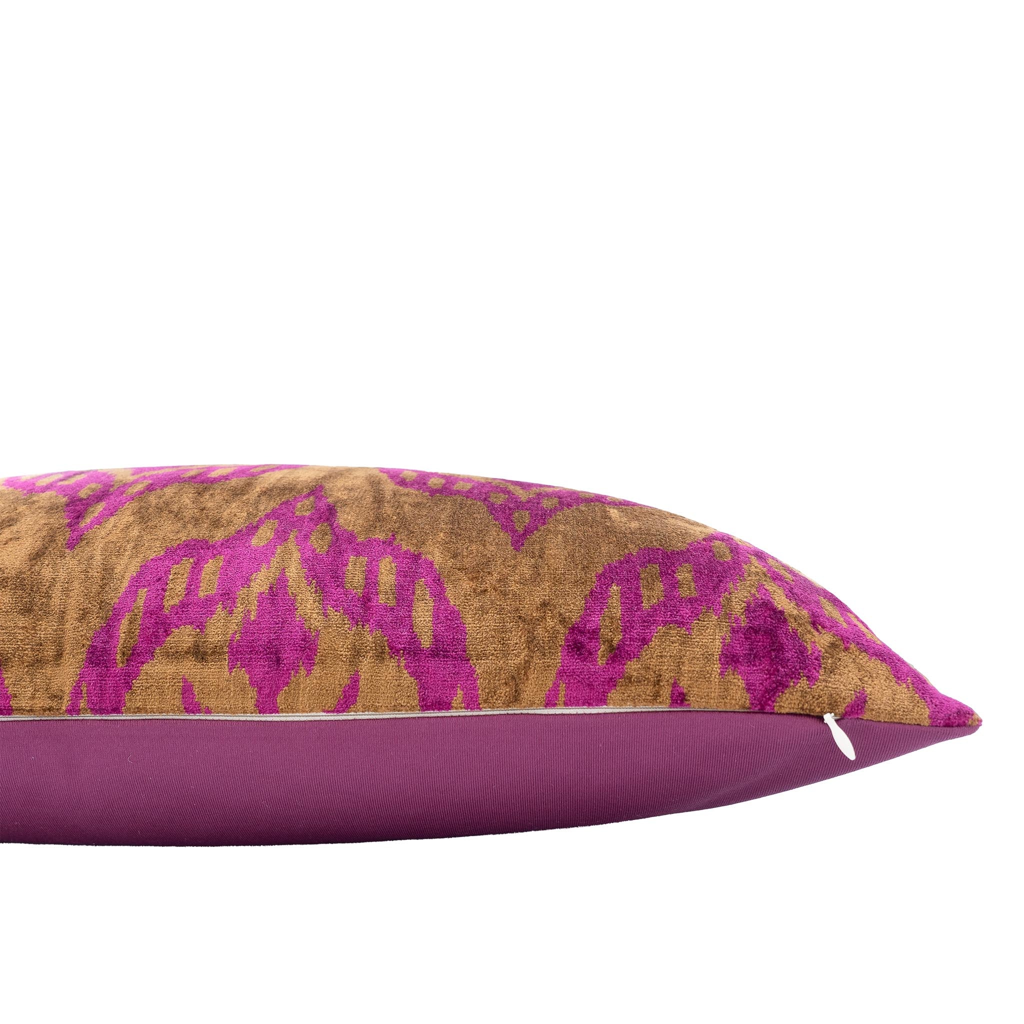 Mood Bronze ikat pillow in golden-brown silk velvet with bold pink motifs.