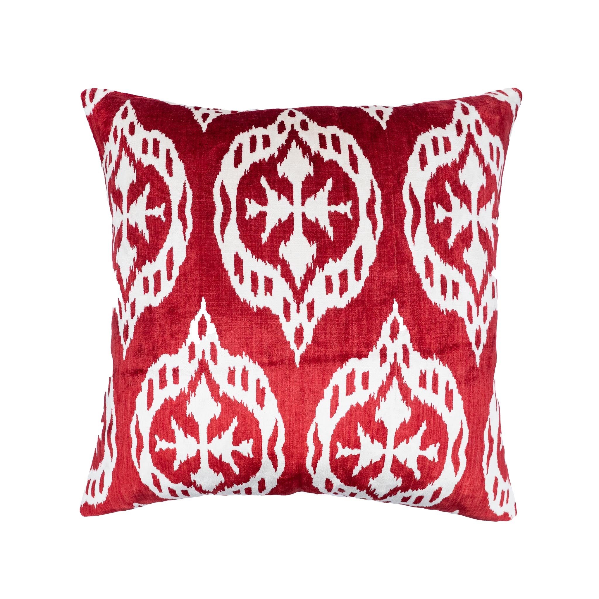 Square merlot red silk velvet ikat pillow with traditional white medallion pattern.