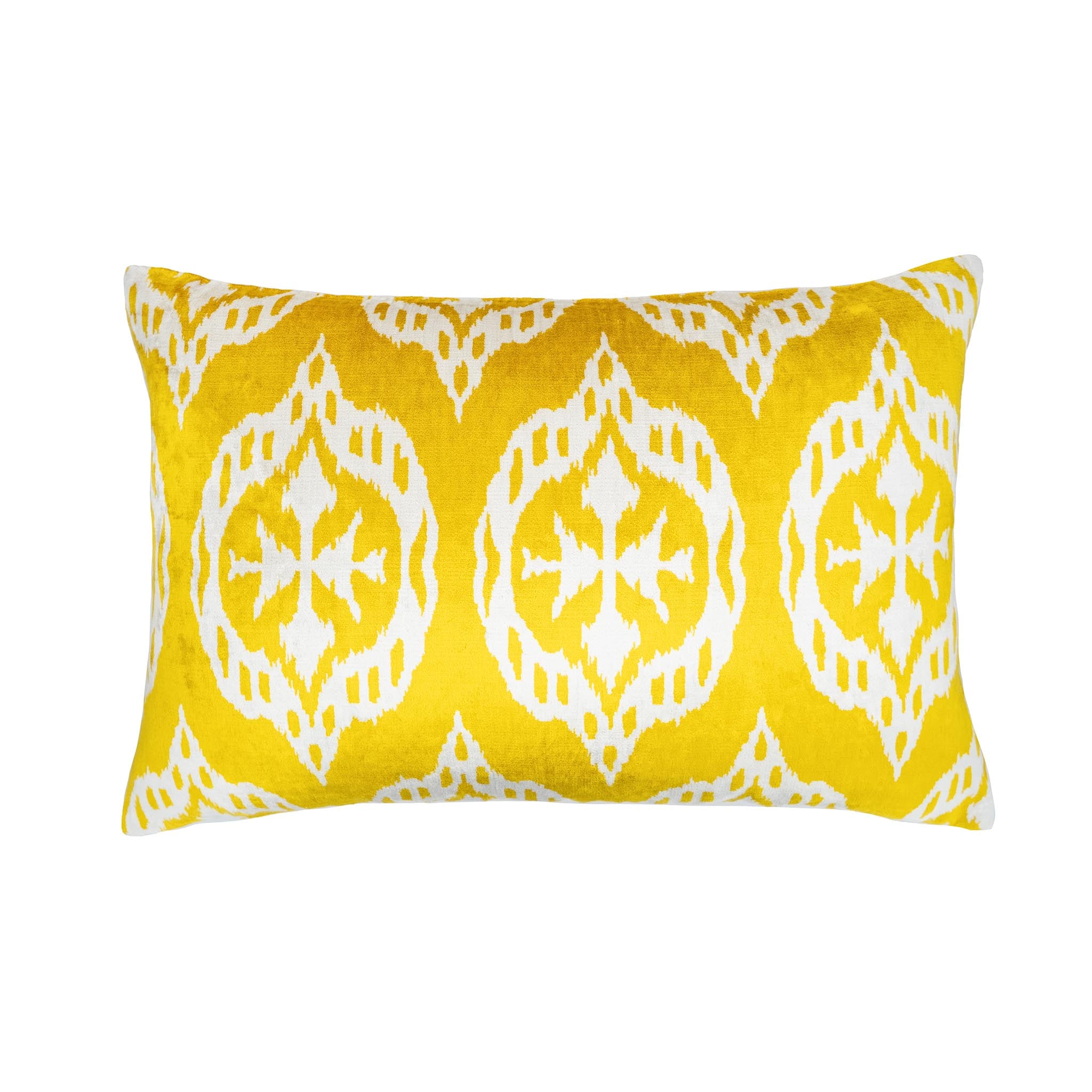 Mood yellow silk velvet ikat pillow with white circular medallion design, 16x24.