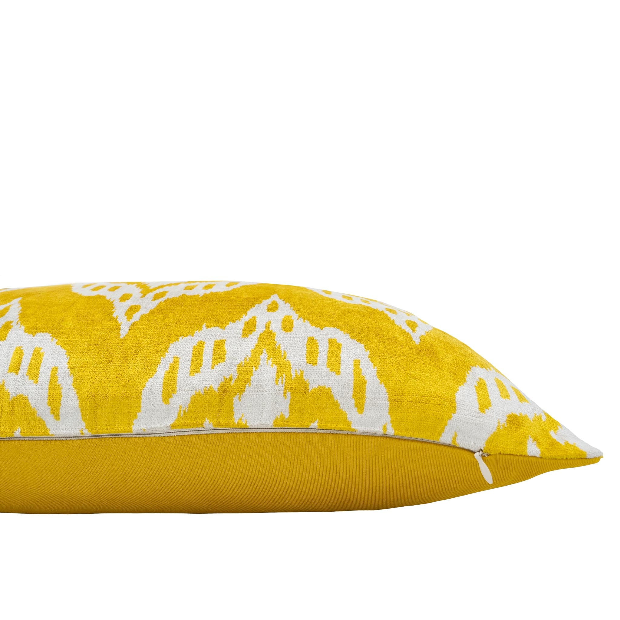 Bright yellow Chouchou Touch silk pillow cover with white ikat motifs.