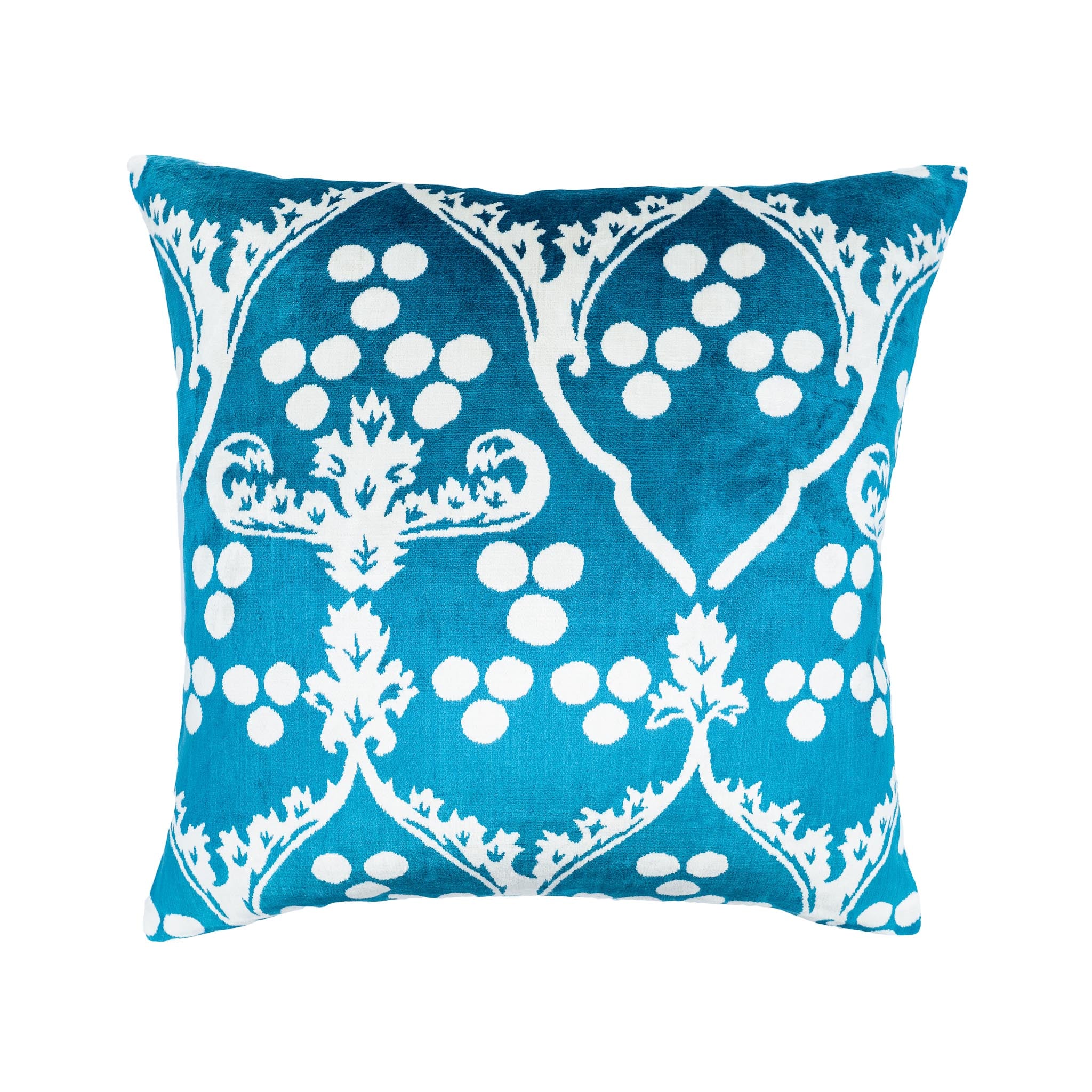 Handwoven blue silk velvet ikat pillow with symmetrical white designs, ideal for luxury home decor.