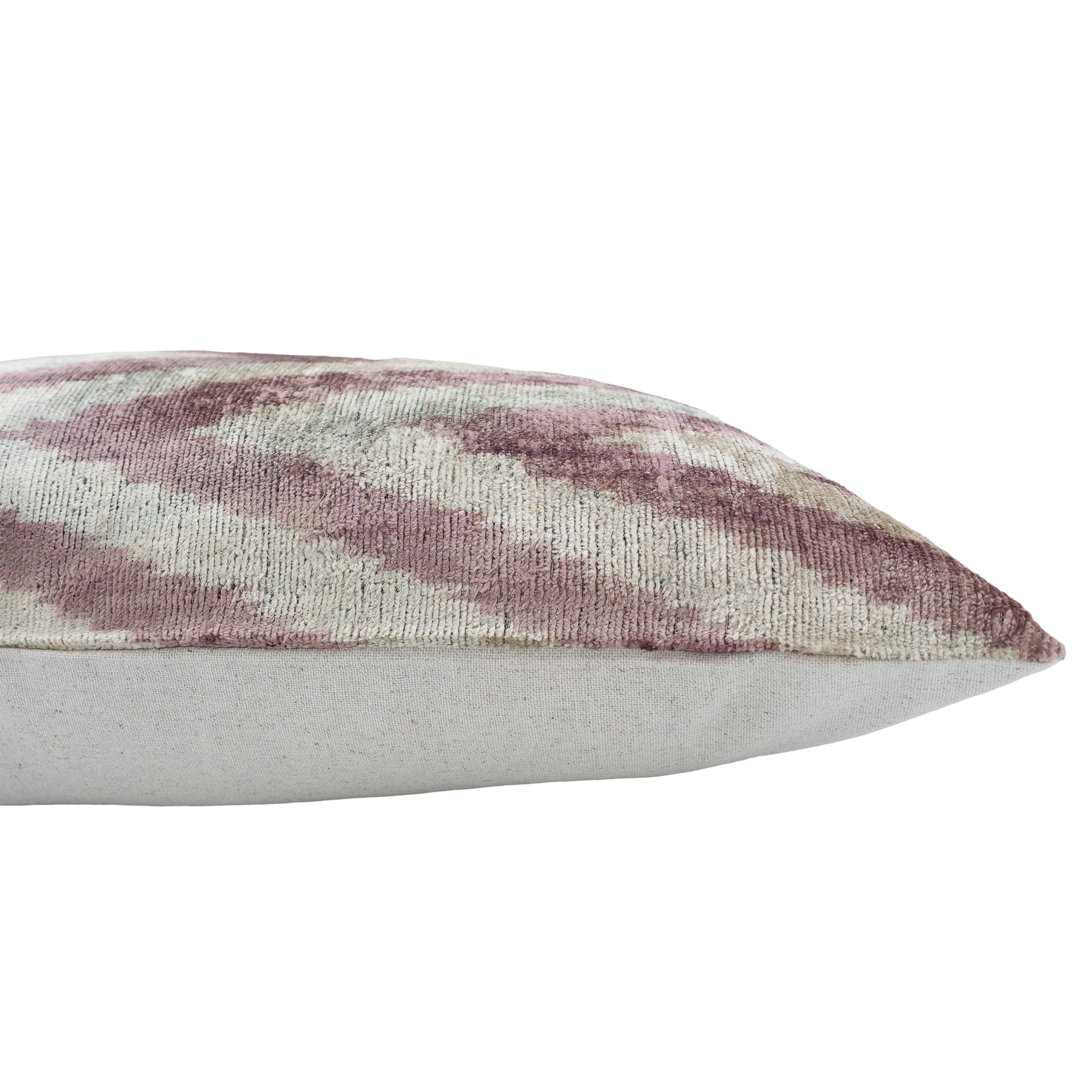 Chouchou Touch ikat throw pillow in muted pink and cream chevron design.