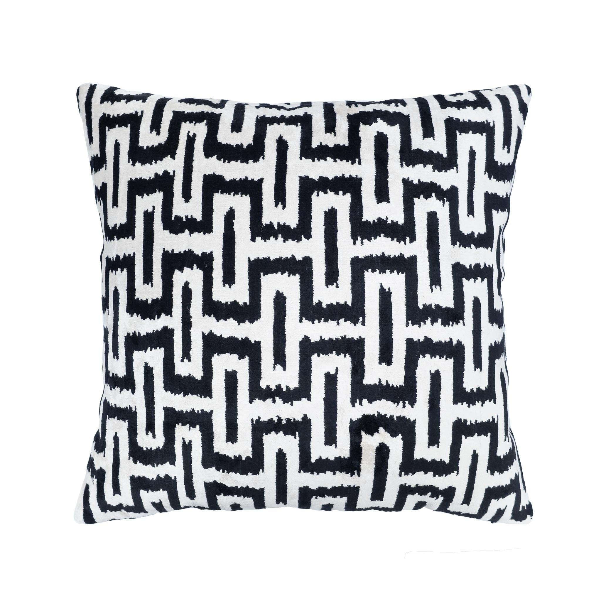 Handwoven silk velvet pillow with a graphic interlocking pattern, perfect for modern spaces.