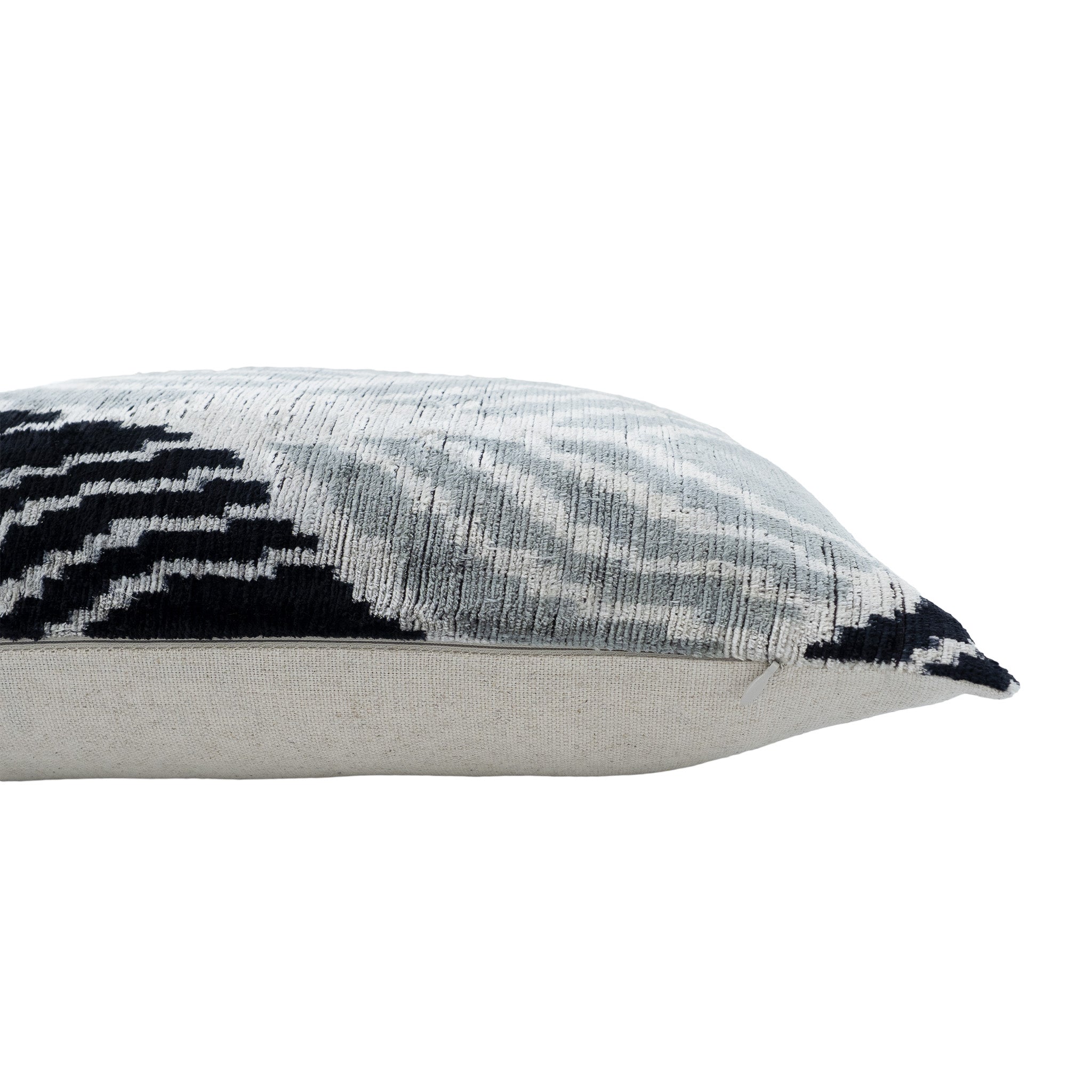 16x24-inch handwoven silk velvet ikat pillow with a modern geometric pattern in black, gray, and white.