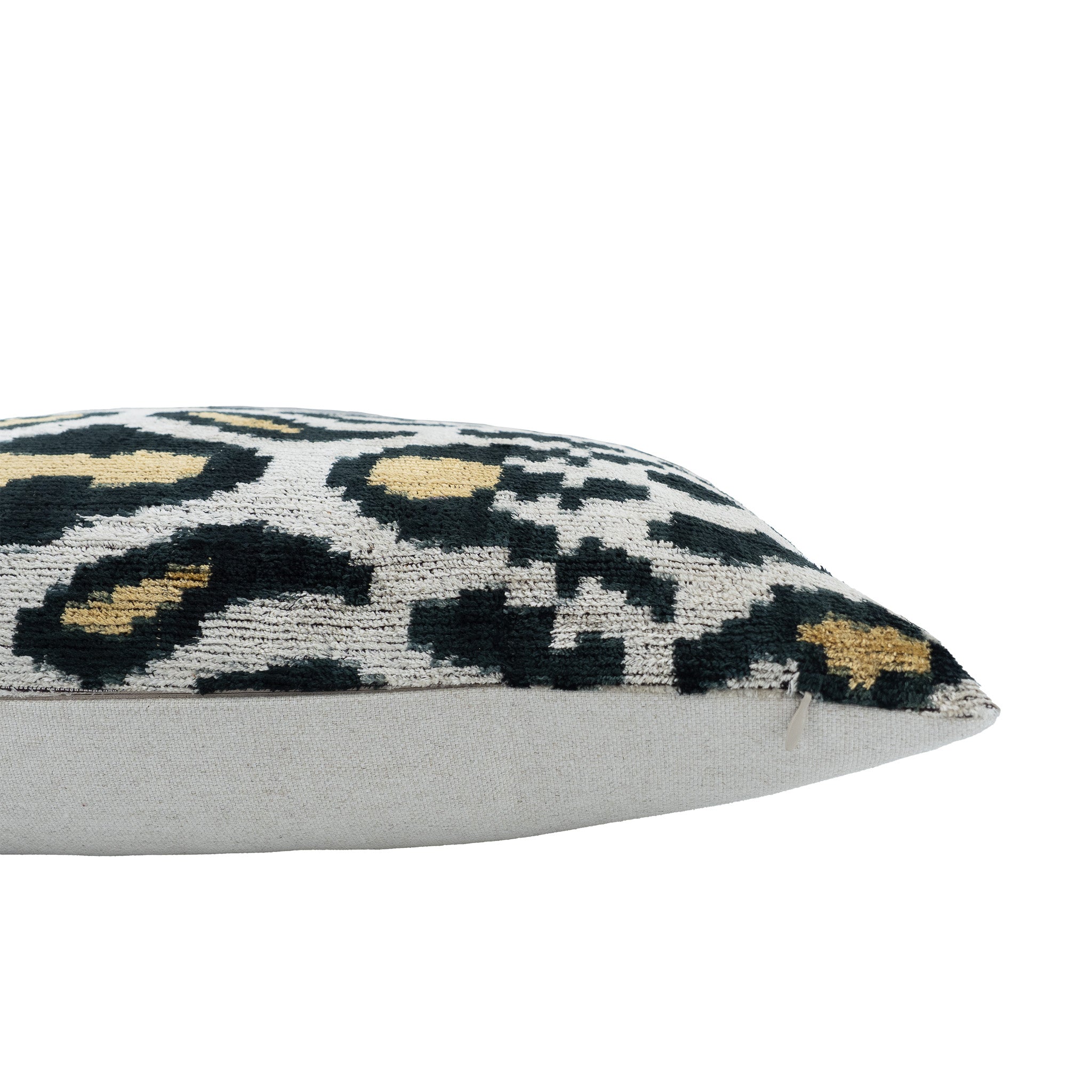 Chouchou Touch ikat pillow cover with abstract animal print in black, tan, and ivory.
