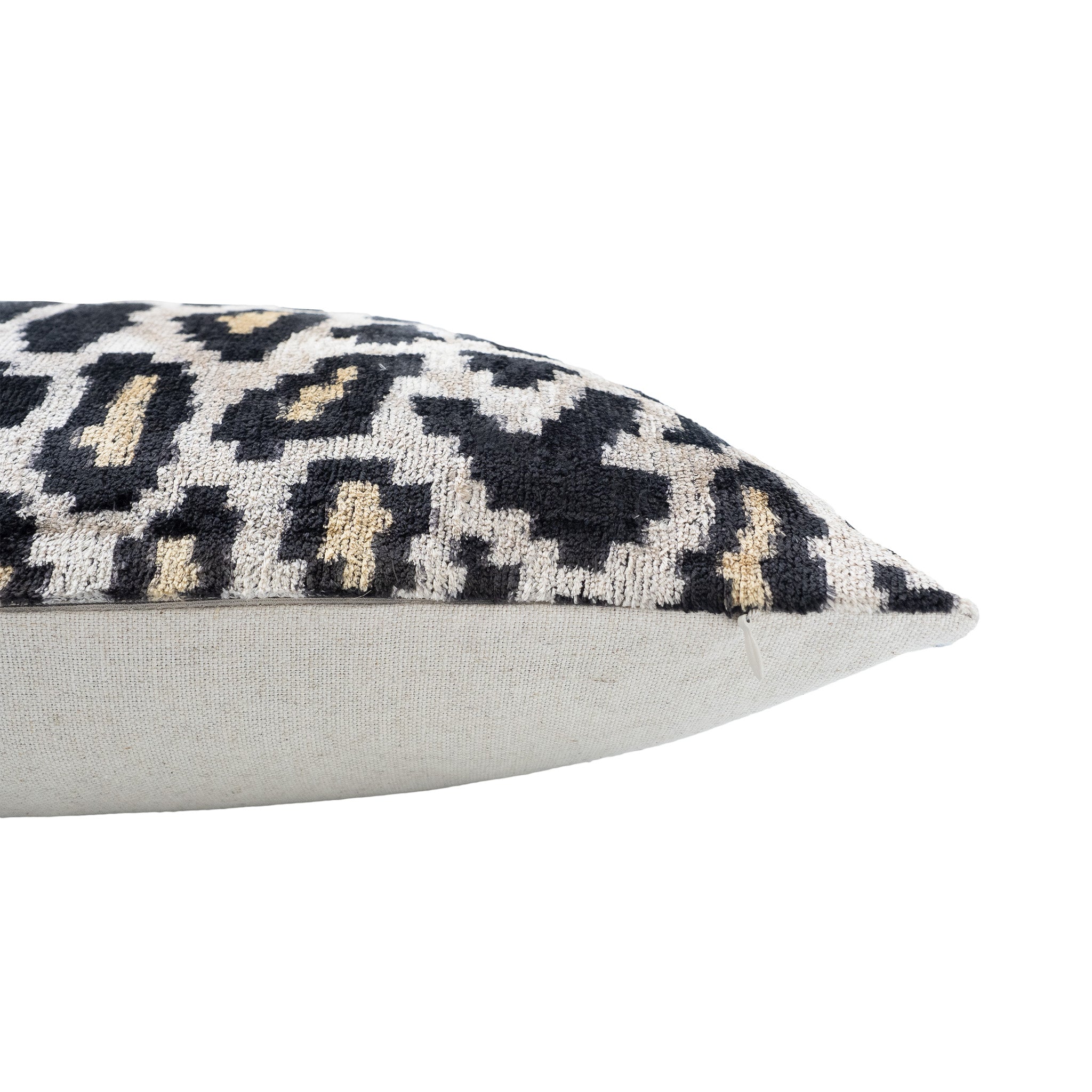 Chouchou Touch square throw pillow with black and gold ikat leopard print.
