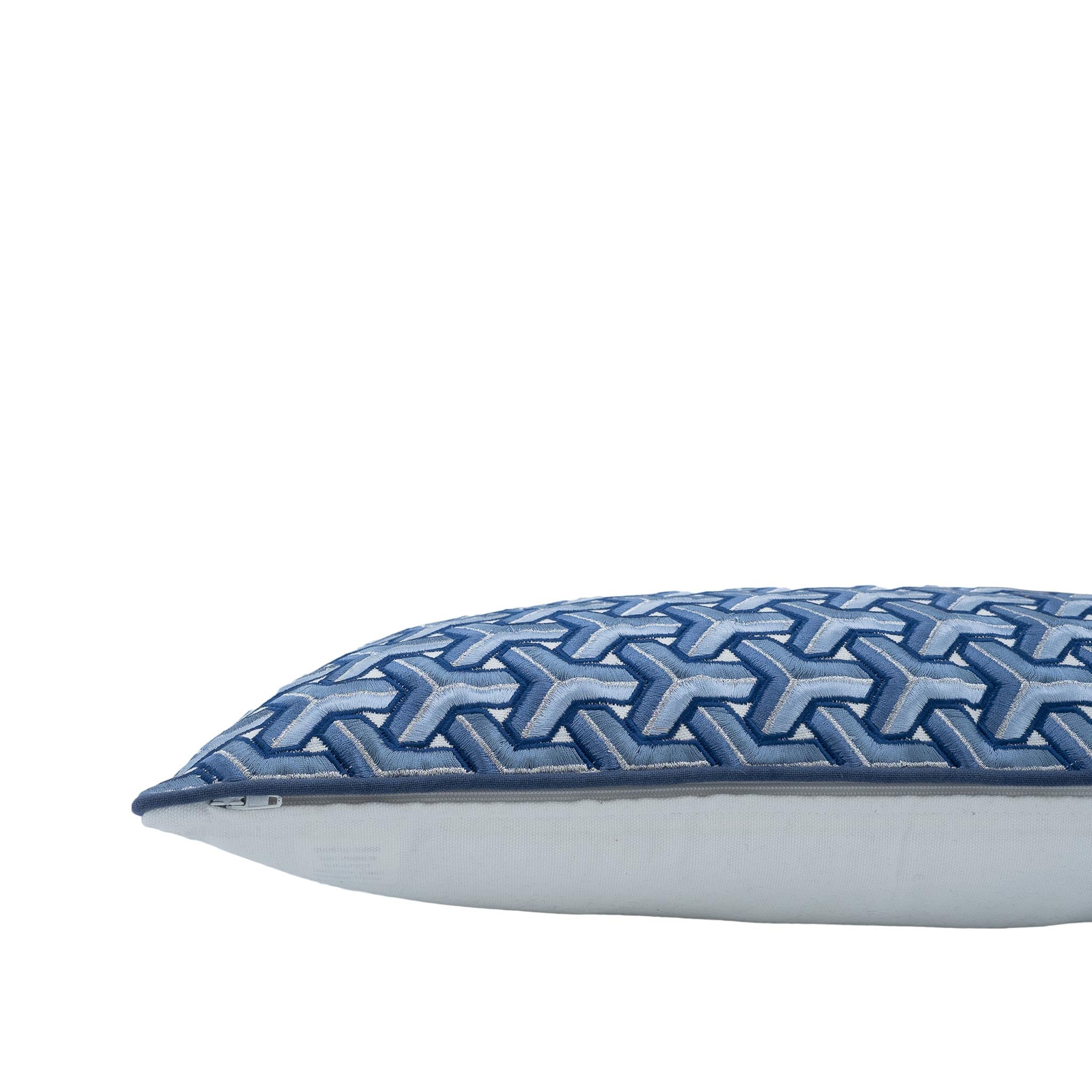 12x20 blue cushion with repeated Y-shape embroidery in varying blue gradients.