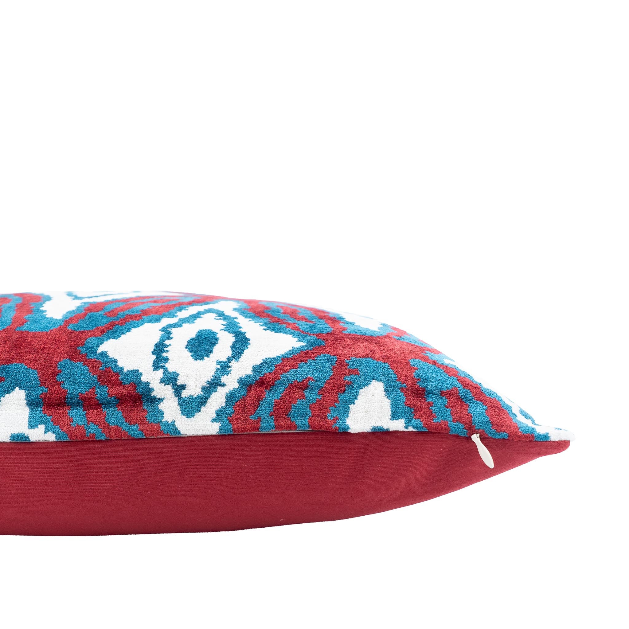 Luxurious handcrafted silk velvet pillow with an intricate Rio ikat design in vibrant hues.