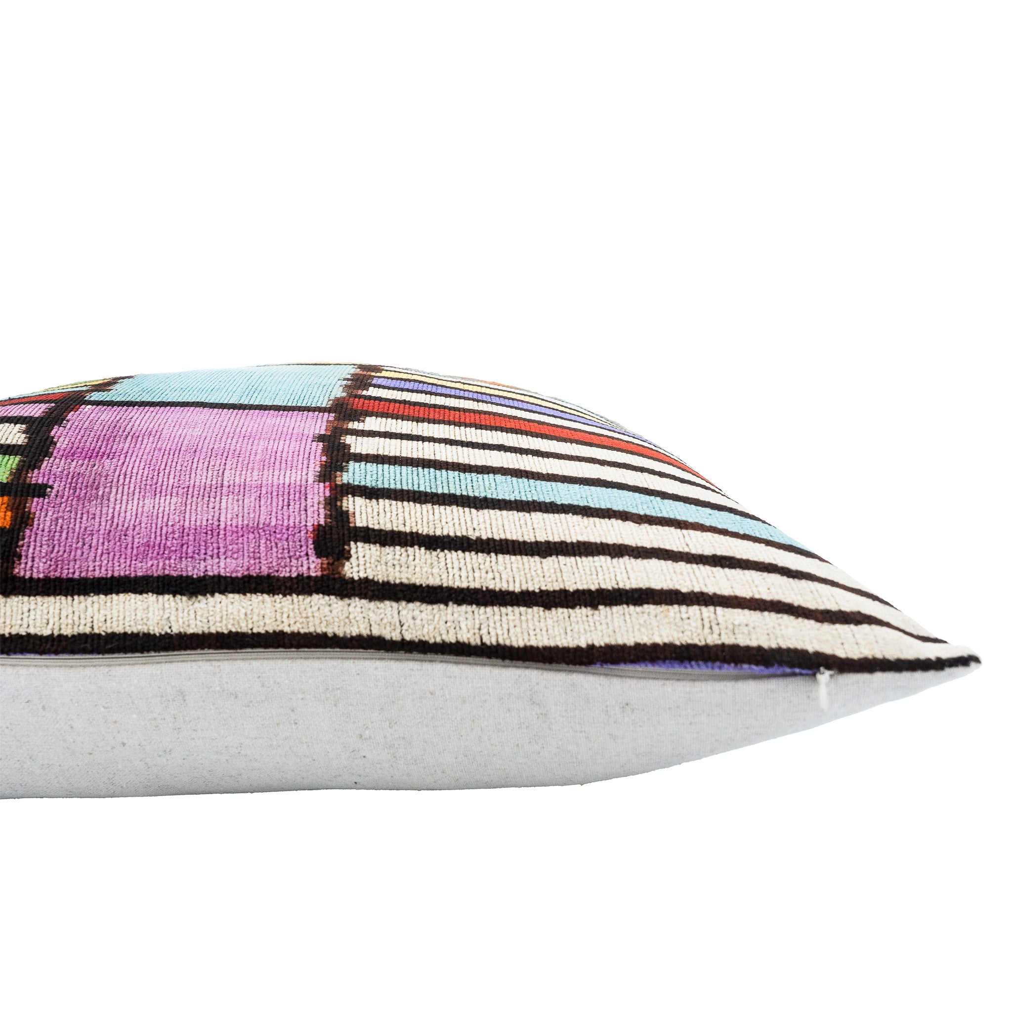 Vibrant and artistic ikat pillow, handcrafted with bold, multicolor stripes and a soft linen backing.