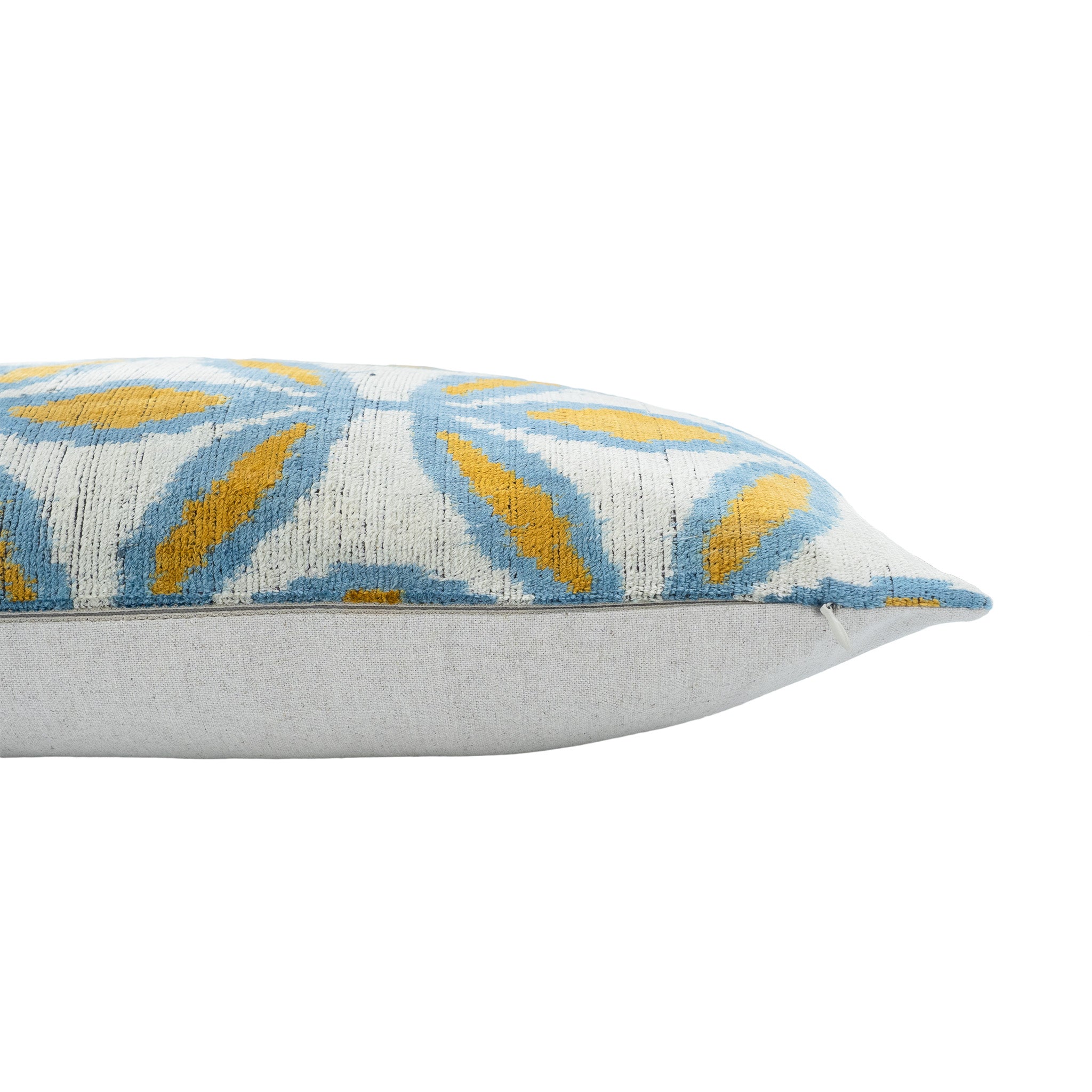Handwoven silk velvet pillow in 16x24-inch size with a sunflower-inspired ikat pattern.